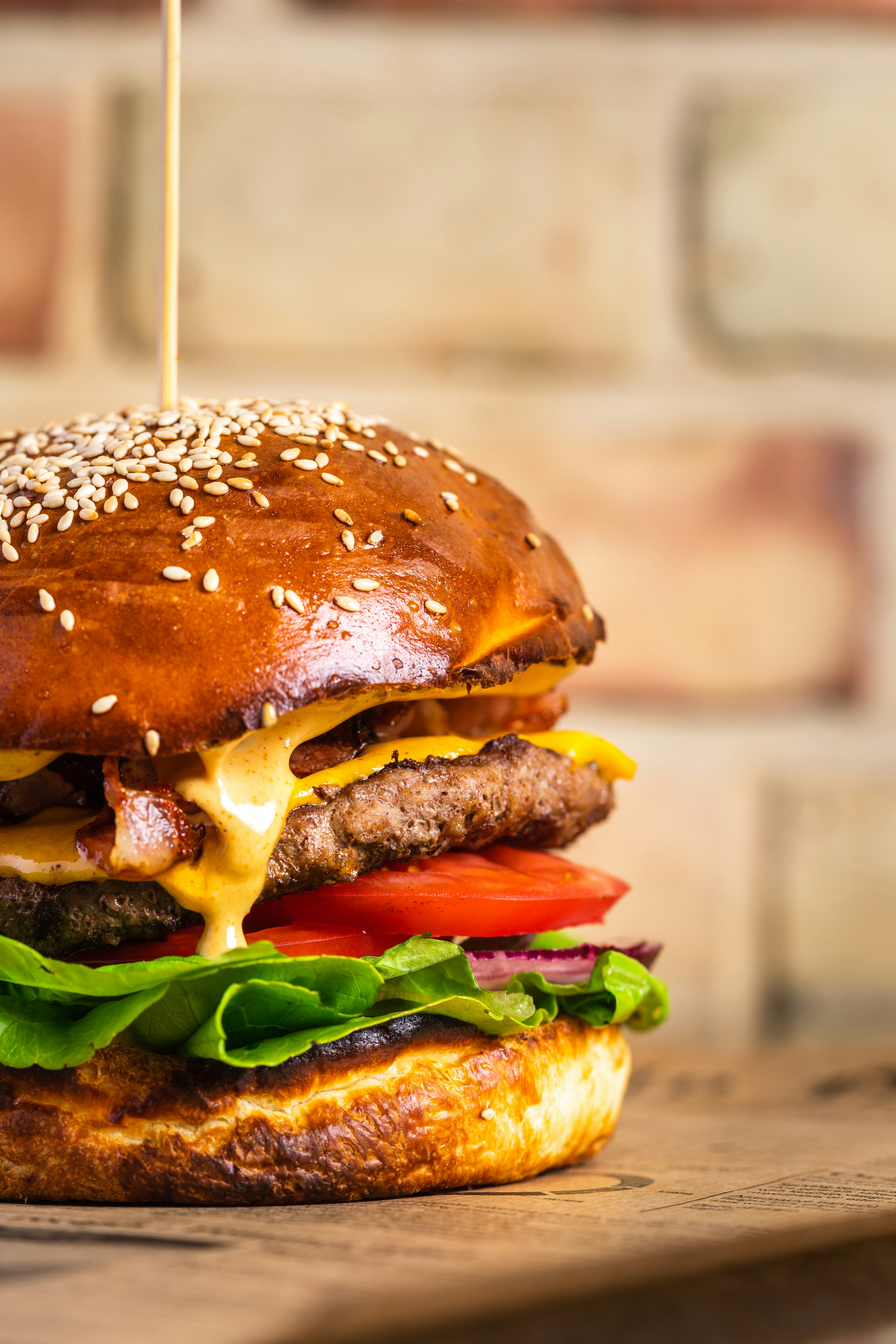 a cheeseburger with a sesame seed bun