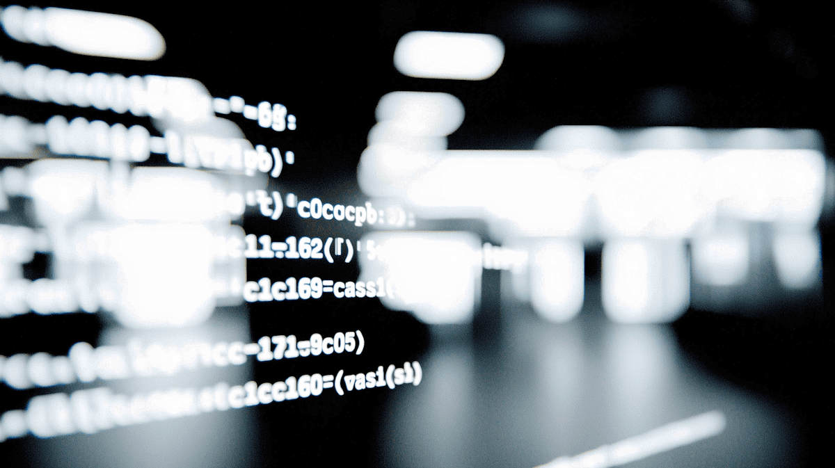 Blurry code on a dark screen