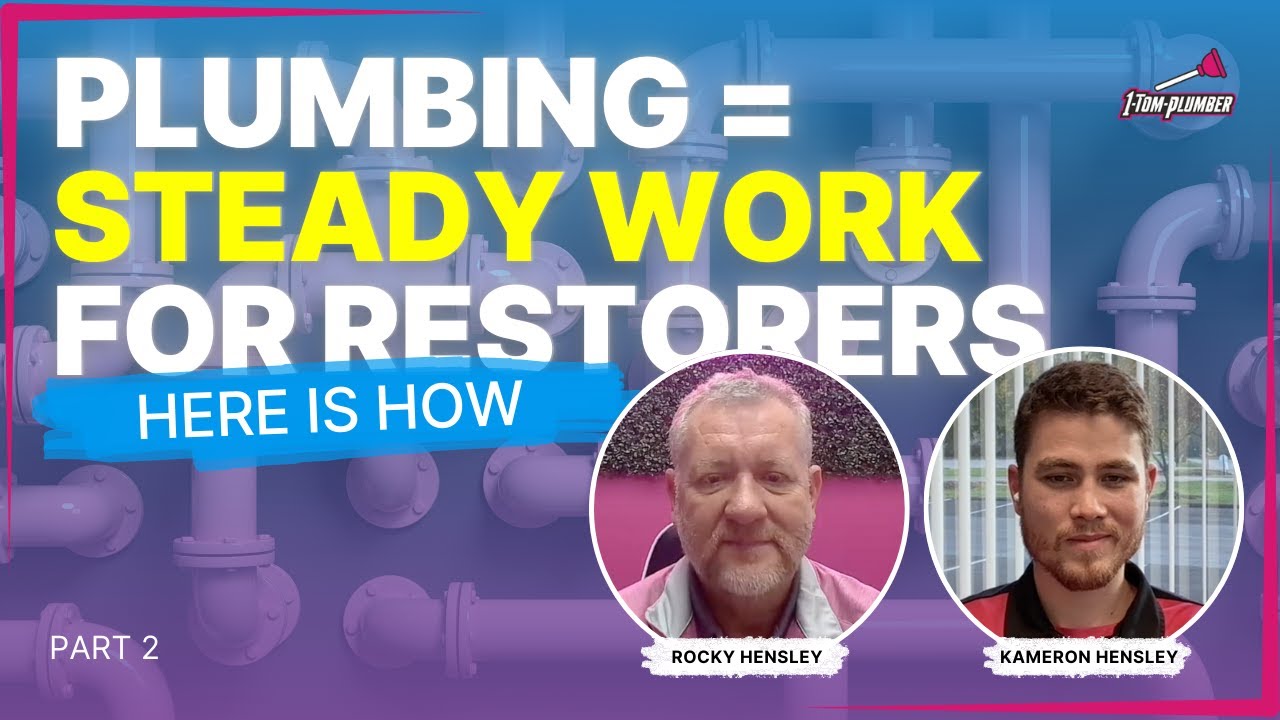 a wall with pipes and two restorers in foreground