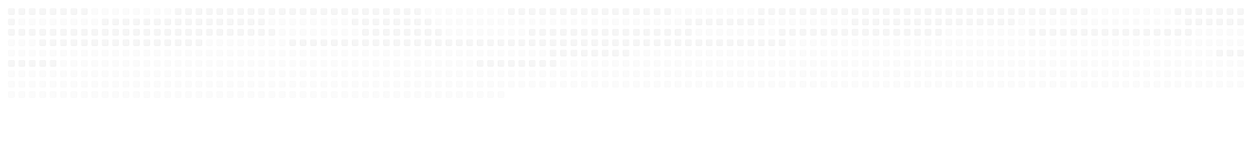 A row of white fence posts supporting a white fence, creating a clean and uniform appearance.