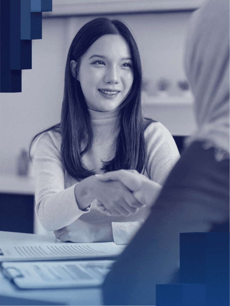 woman sitting around table holding tablet