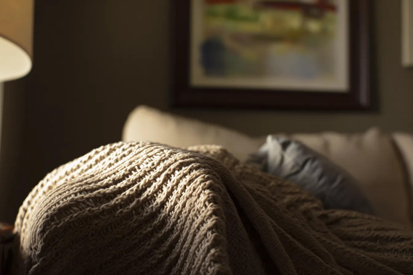 Soft-lit therapy space with cozy seating for clients