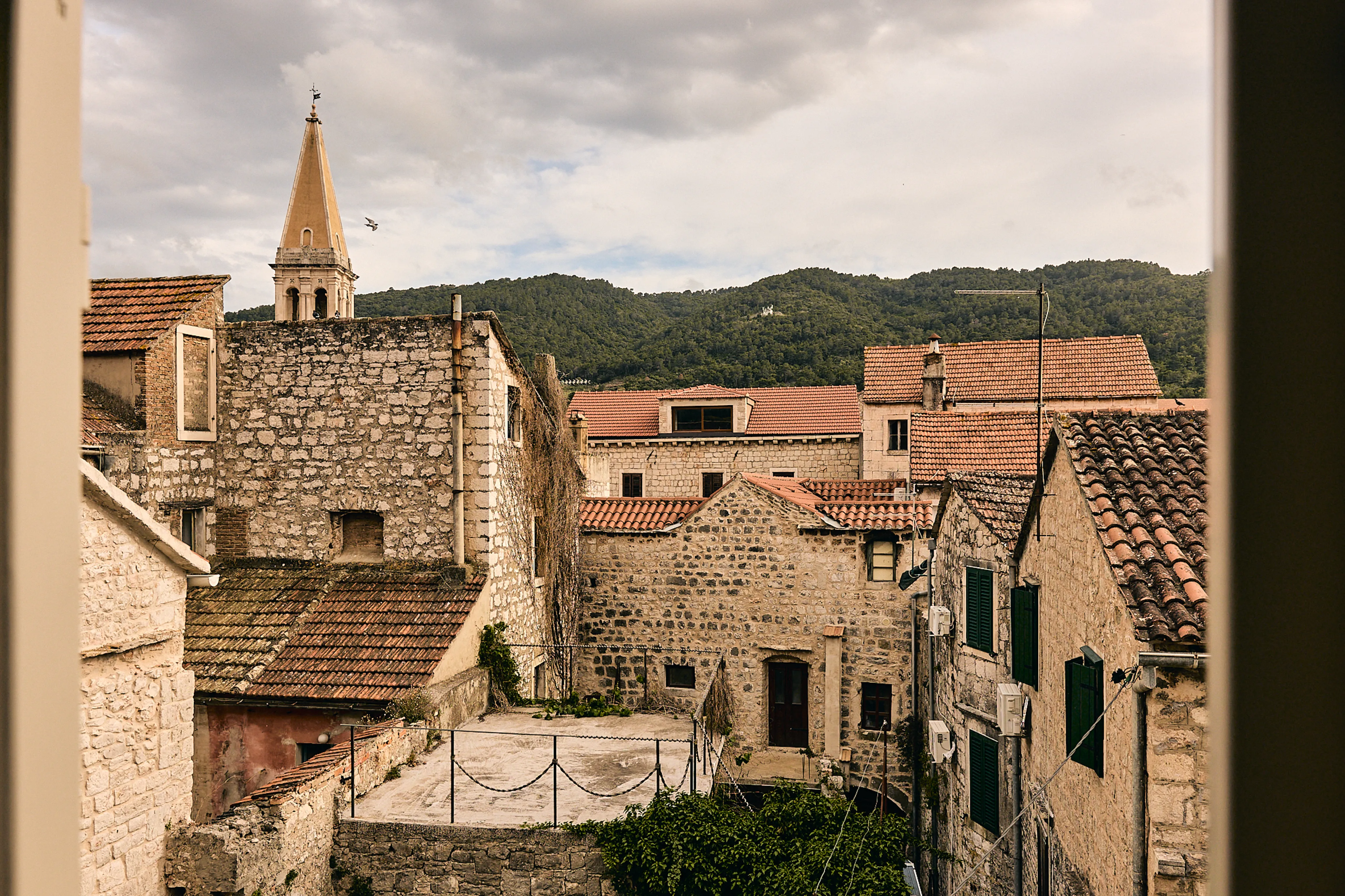 View over Stari Grad old town rooftops and church tower from Hidden House boutique accommodation, Hvar island Croatia