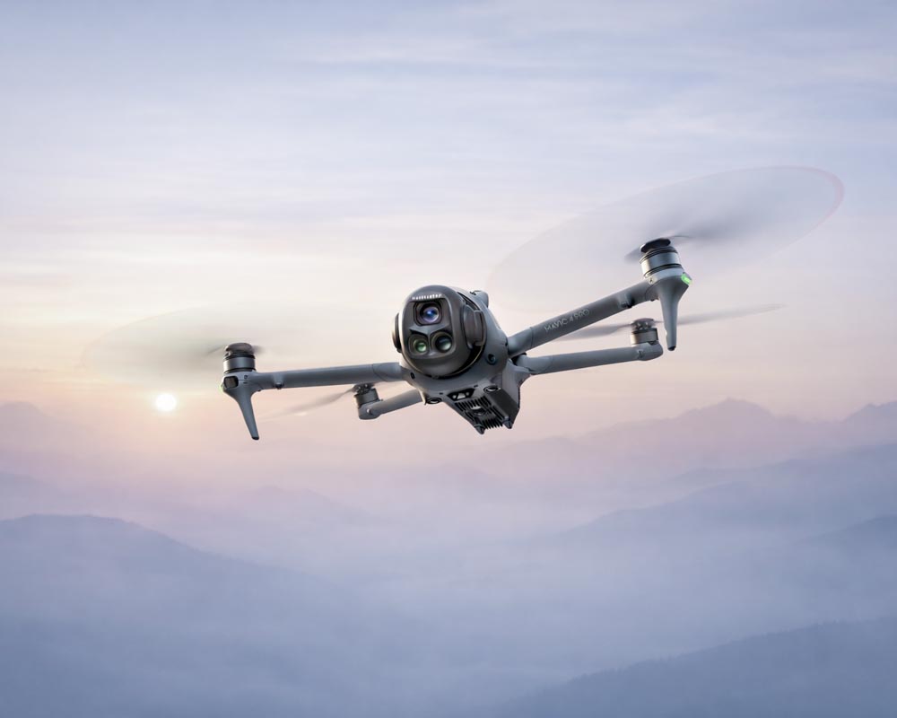 gray quadcopter flying