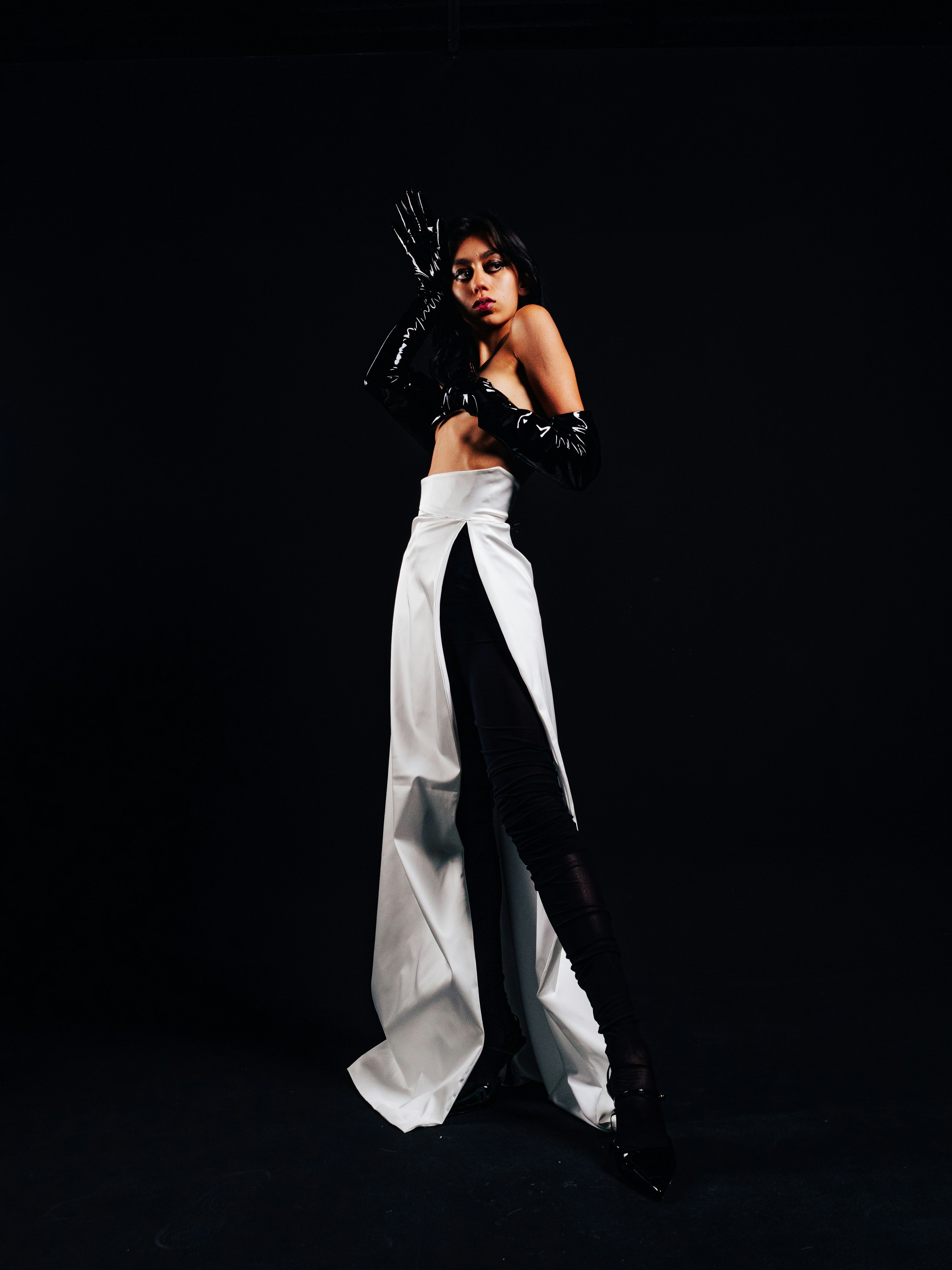 a man and woman sitting in a convertible car