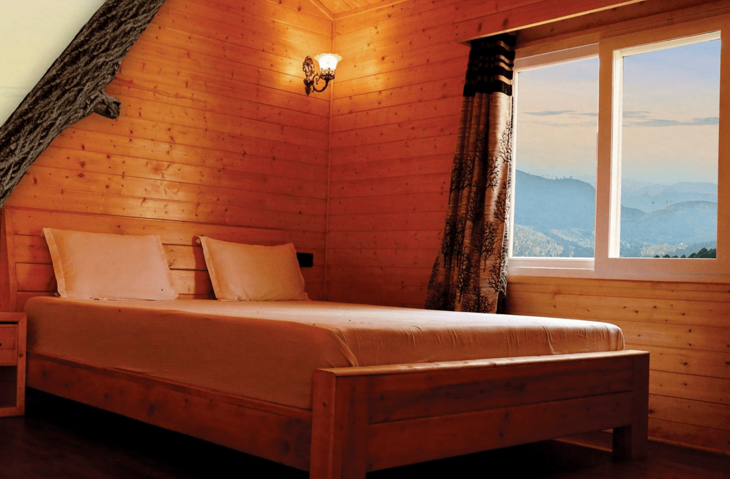 <img src="bedroom-view.jpg" alt="Cozy bed in a bedroom with a window overlooking mountains and blue sky.">
