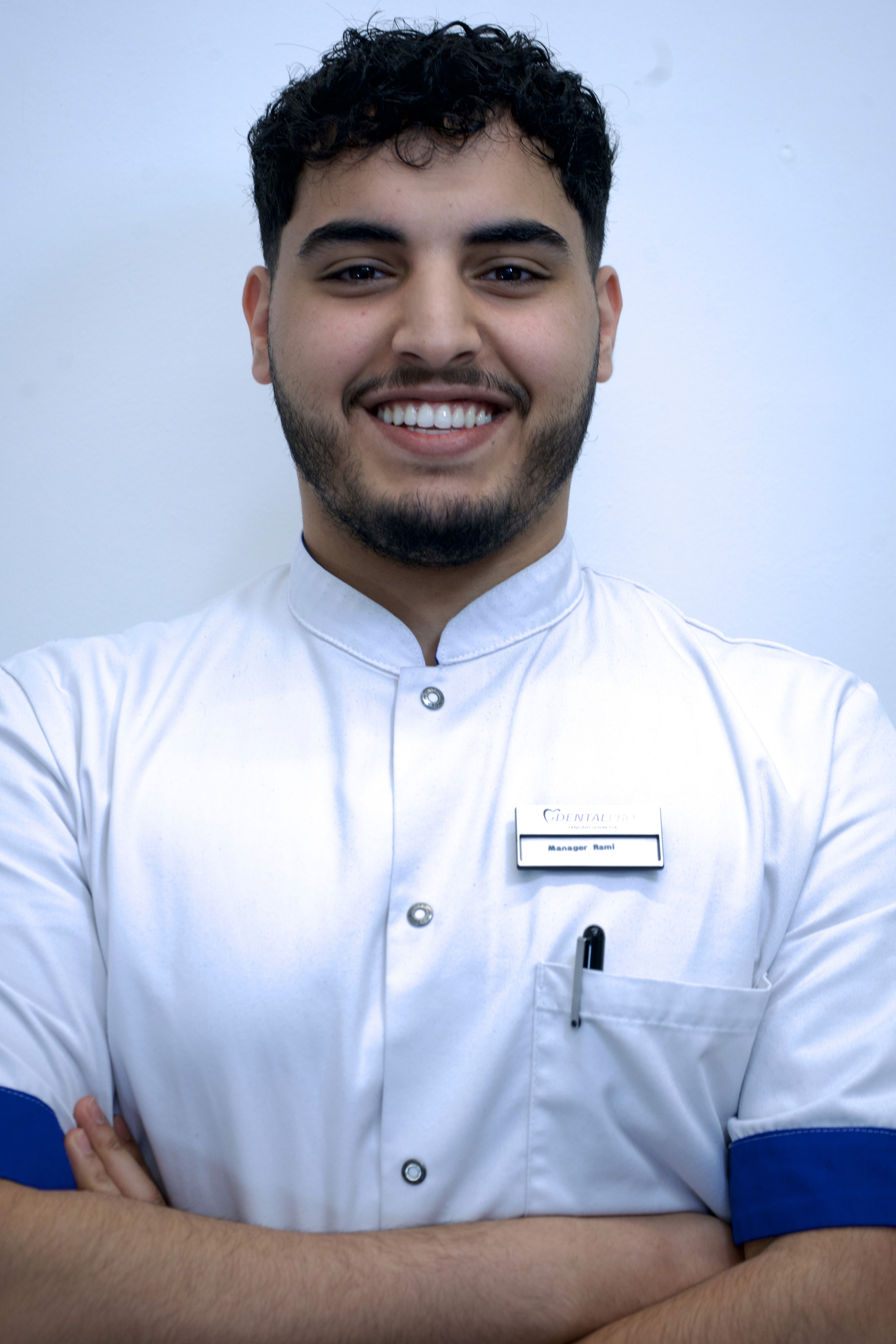 Portrait of a person in dark clothing speaking on a phone