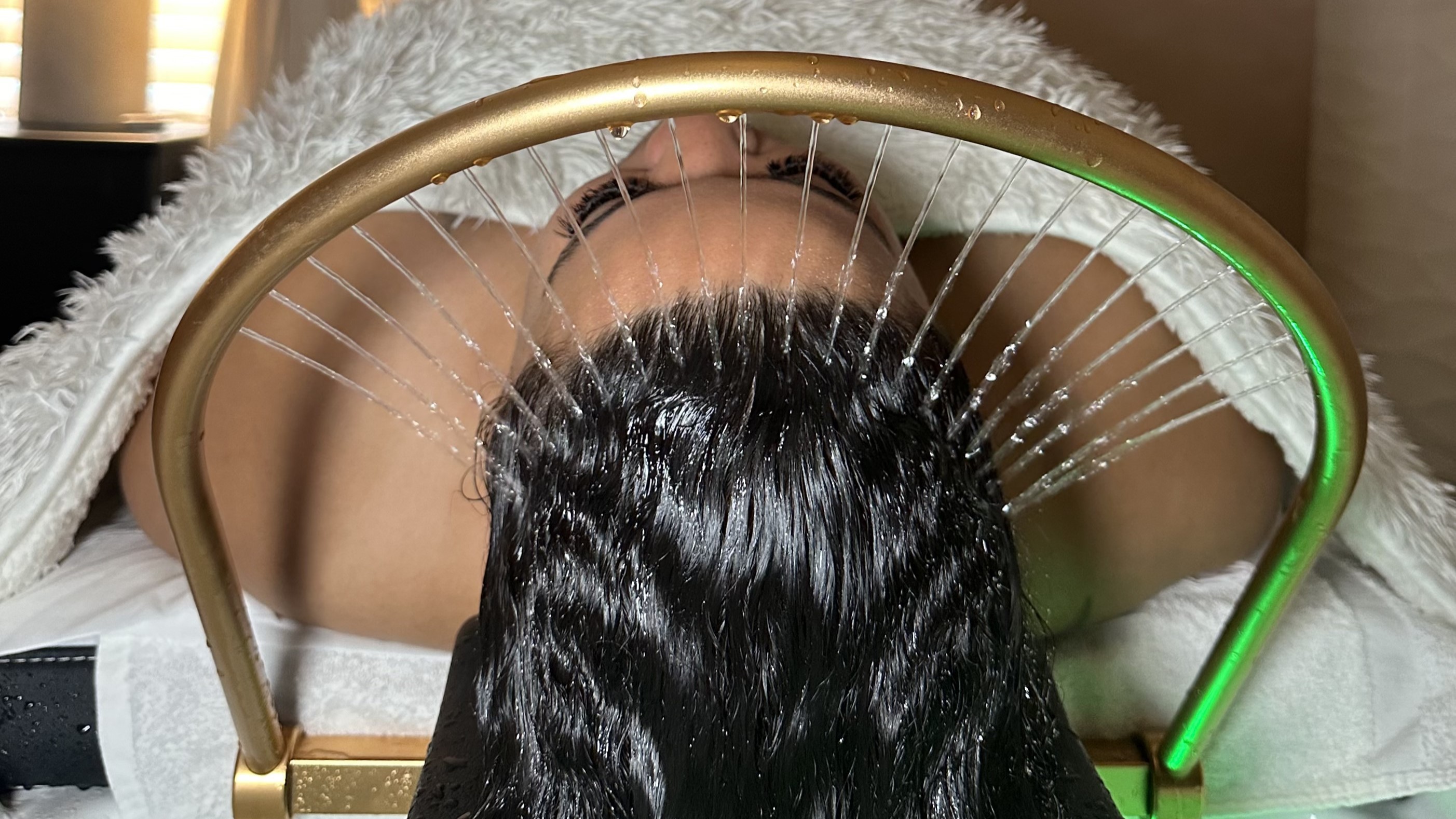 Woman receiving a high-quality scalp treatment