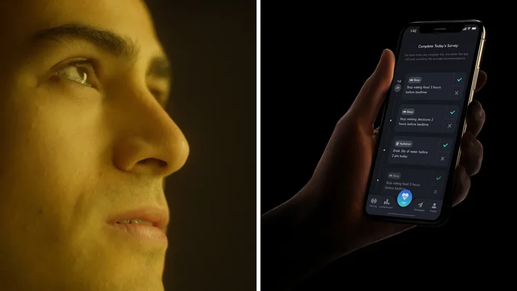 Close-up of a woman's face looking to the left, illuminated in warm light, with a smartphone in her hand displaying a health app with a survey and hydration reminders.
