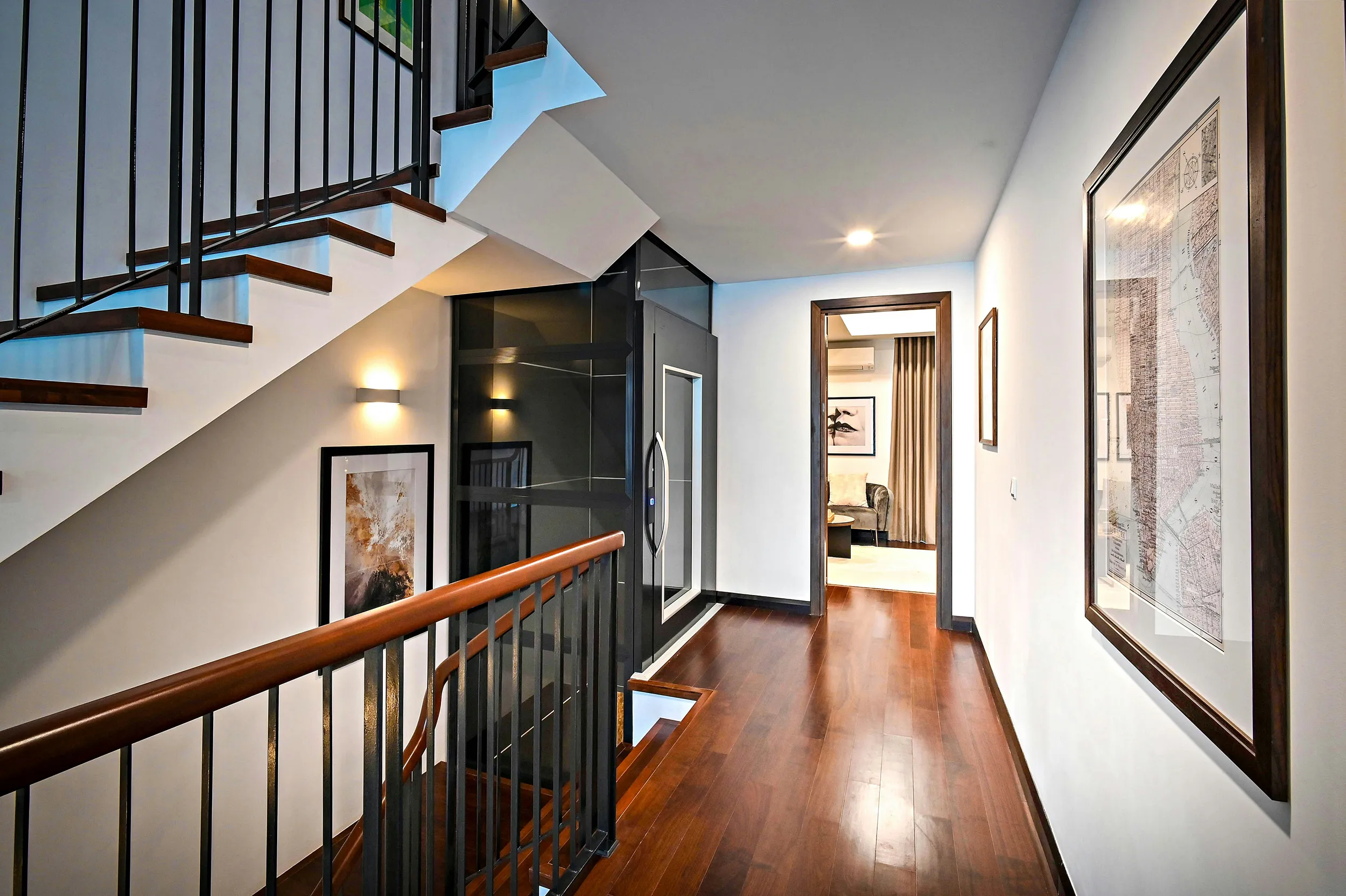 Modern home interior with wooden staircase and hallway, bright residential design