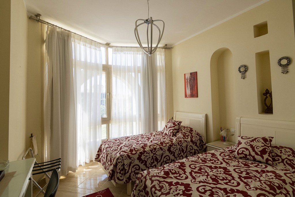 white and brown concrete building under blue sky during daytime