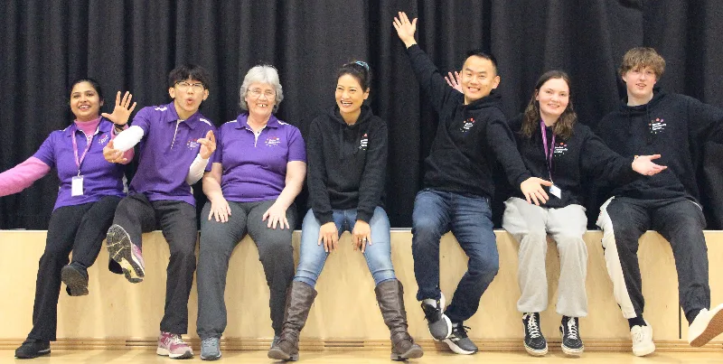 Staff members sitting together for a group photo