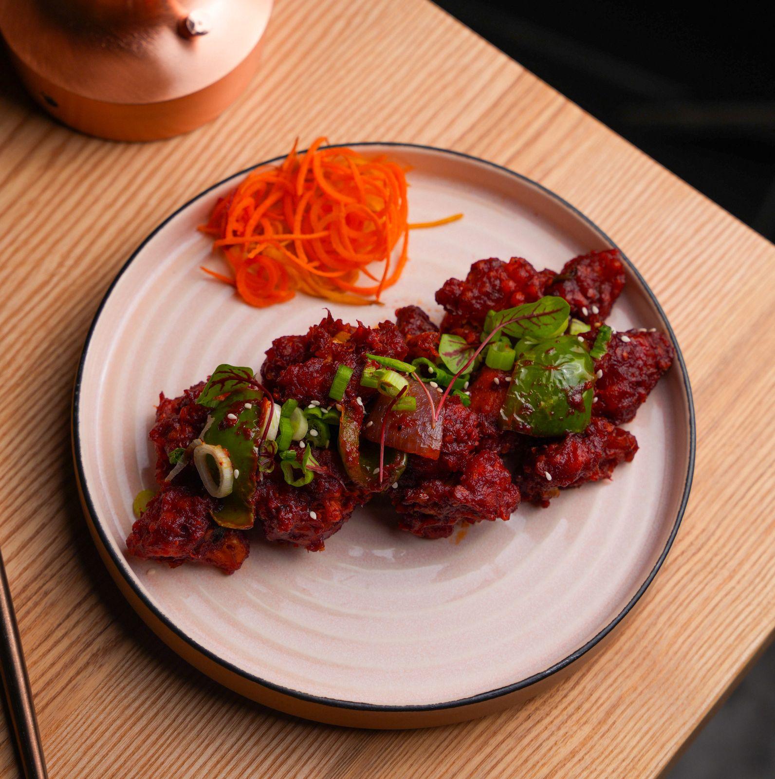 Indo-Chinese chilli chicken at Dhoom Greektown Toronto, crispy chicken tossed with peppers and spicy sauce