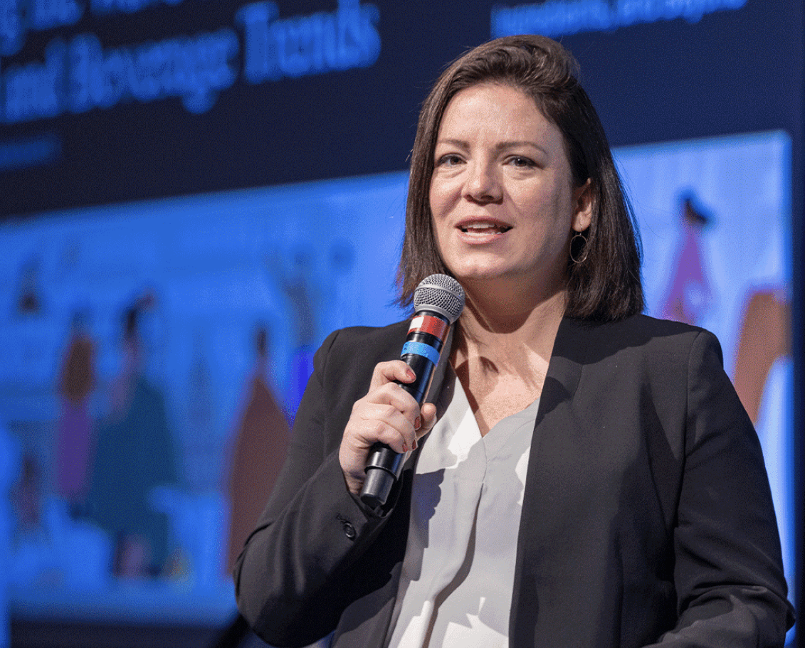 Photo of Nicole Hill speaking at SupplySide Global