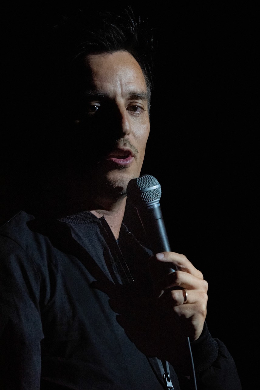 Joe Latham Holding A Microphone