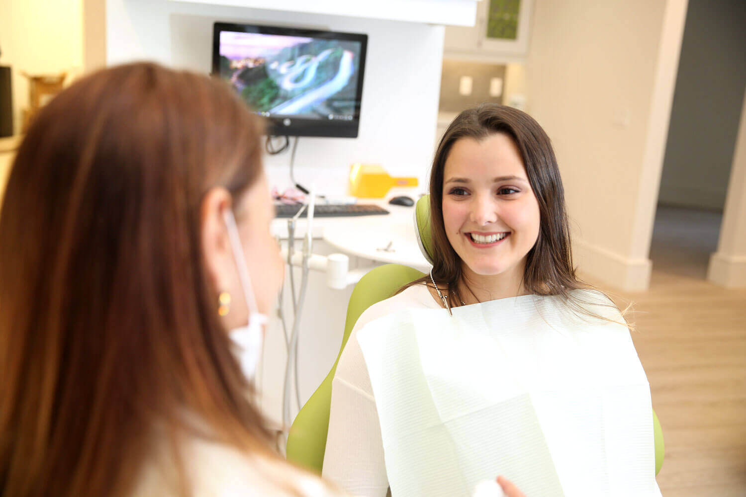 Patient talking with their dentist at Midtown Dental Studio on Eglinton in Midtown Toronto, Ontario | Best Dentist in Midtown Toronto, Ontario