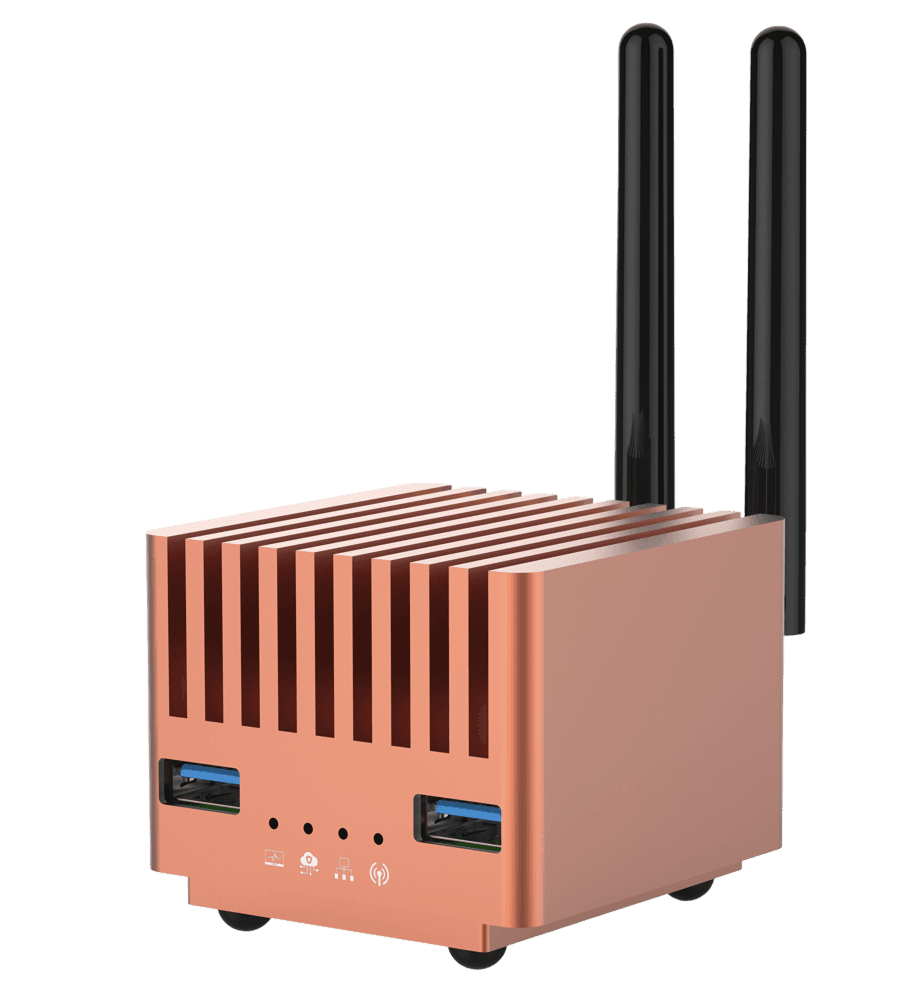 Copper mini PC with two antennas and USB ports.