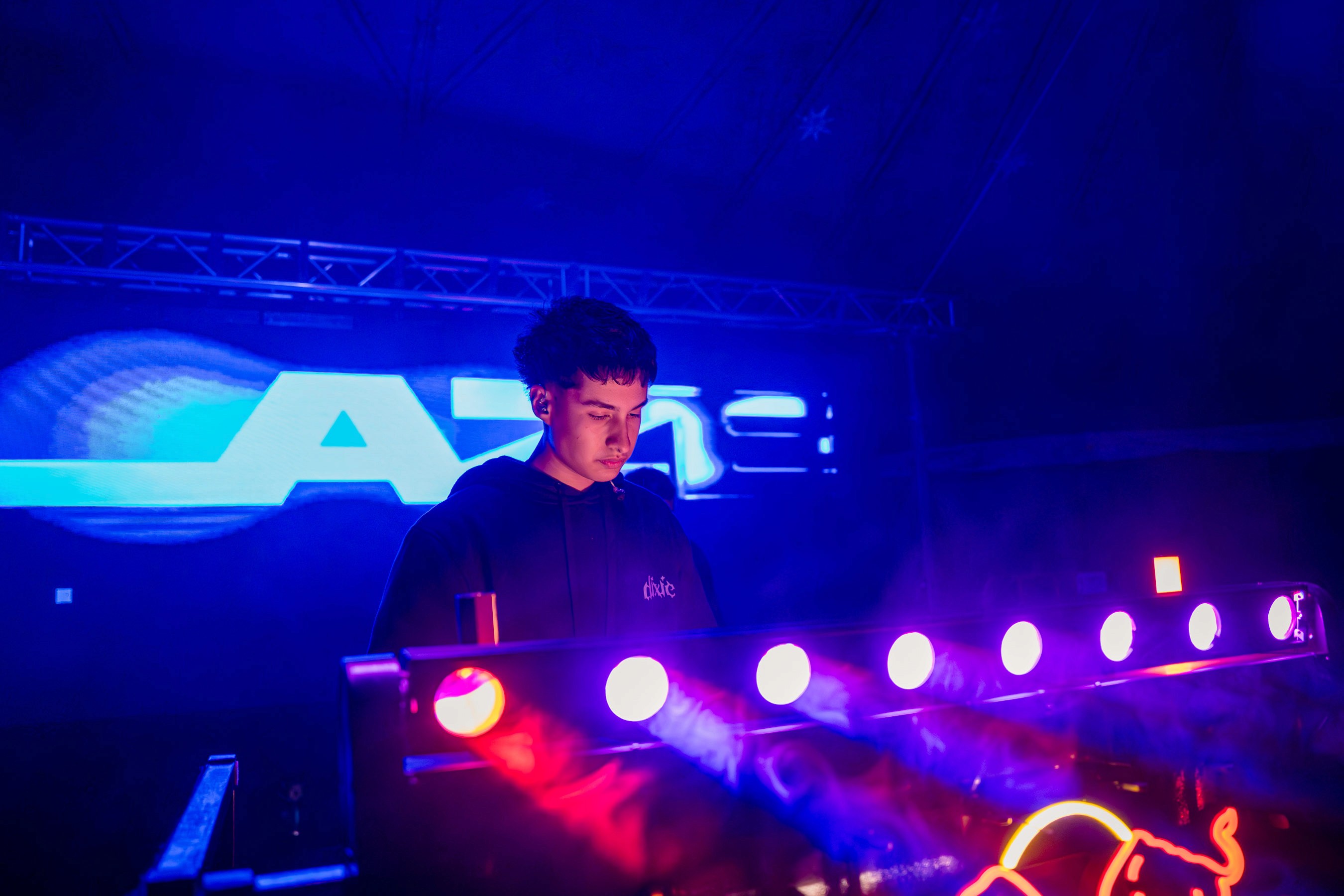 Rachel, personal trainer, looking to the side confidently in a fitness studio