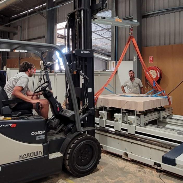 Due to the weight, each quadrant of tabletop was forked onto the CNC machine