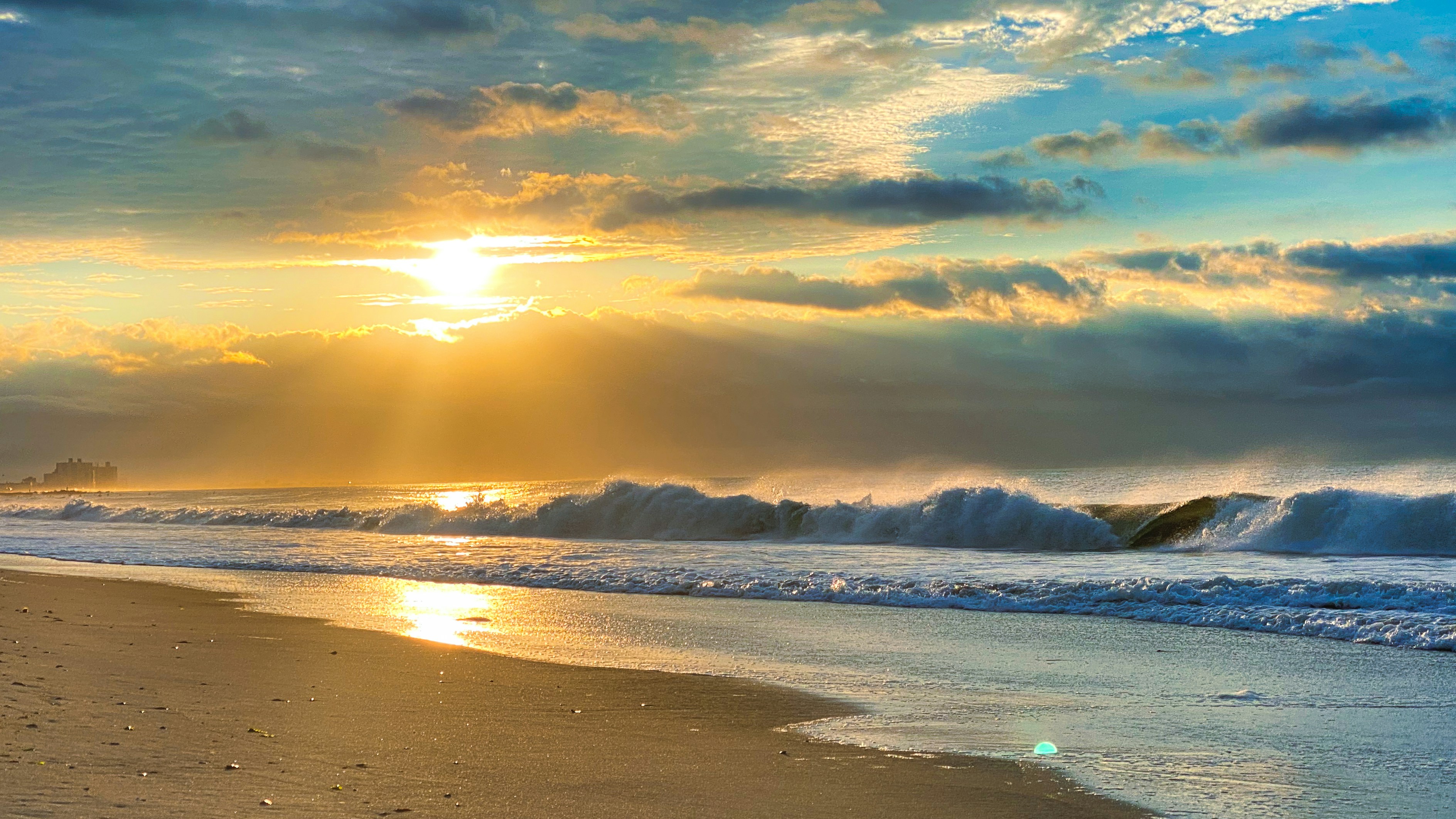people on beach during sunset