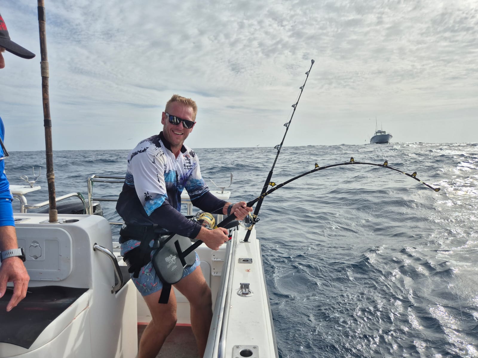 Fishermen celebrating a successful catch on a Salt Safari charter.