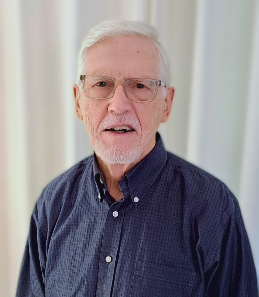 woman in gray coat singing on stage