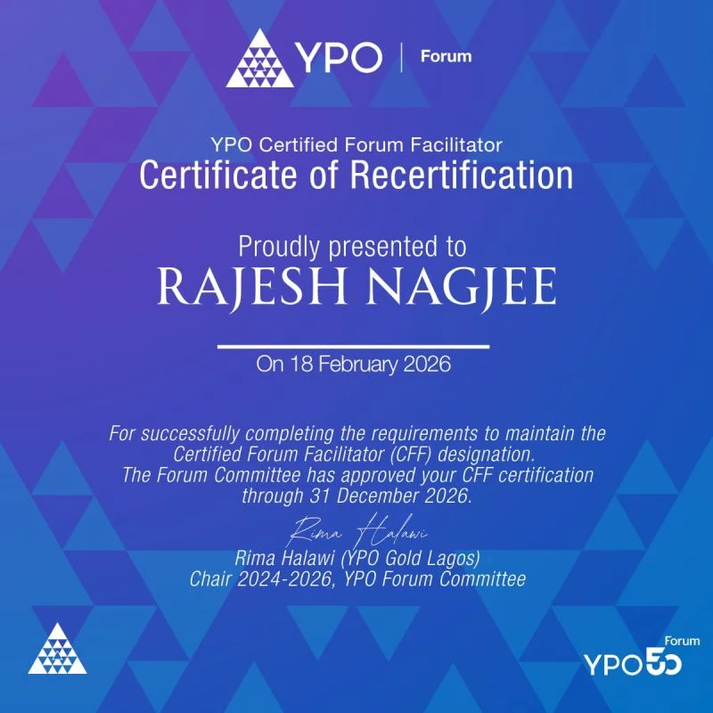 Flat-Structuring 101 cartoon: an org chart shows Chairman at top, C-suite below, then an empty tier, then all junior employees doing everything. One person calls it efficient. Another thinks it's one resignation away from chaos. — Rajesh Nagjee, CEO Freedom OS™