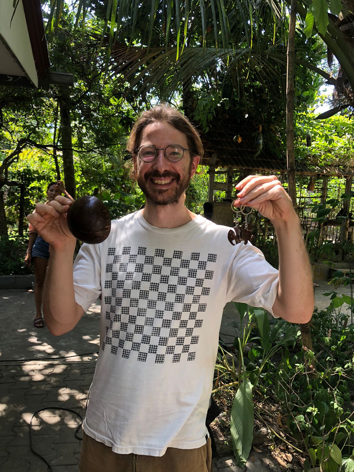 A man playing a drum in front of a group of people