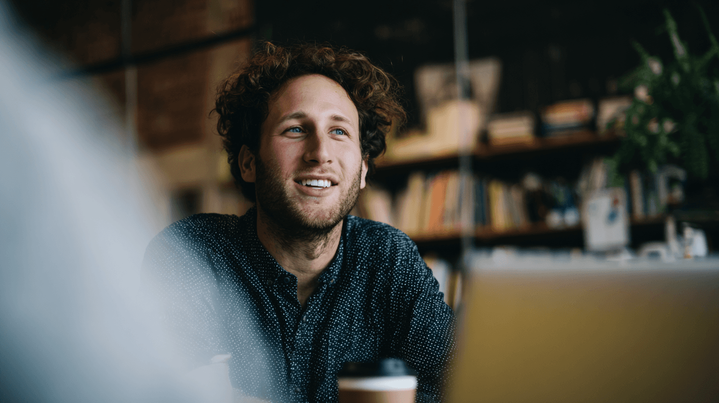 A maroon passport, a credit card, and a document are placed on a dark surface.