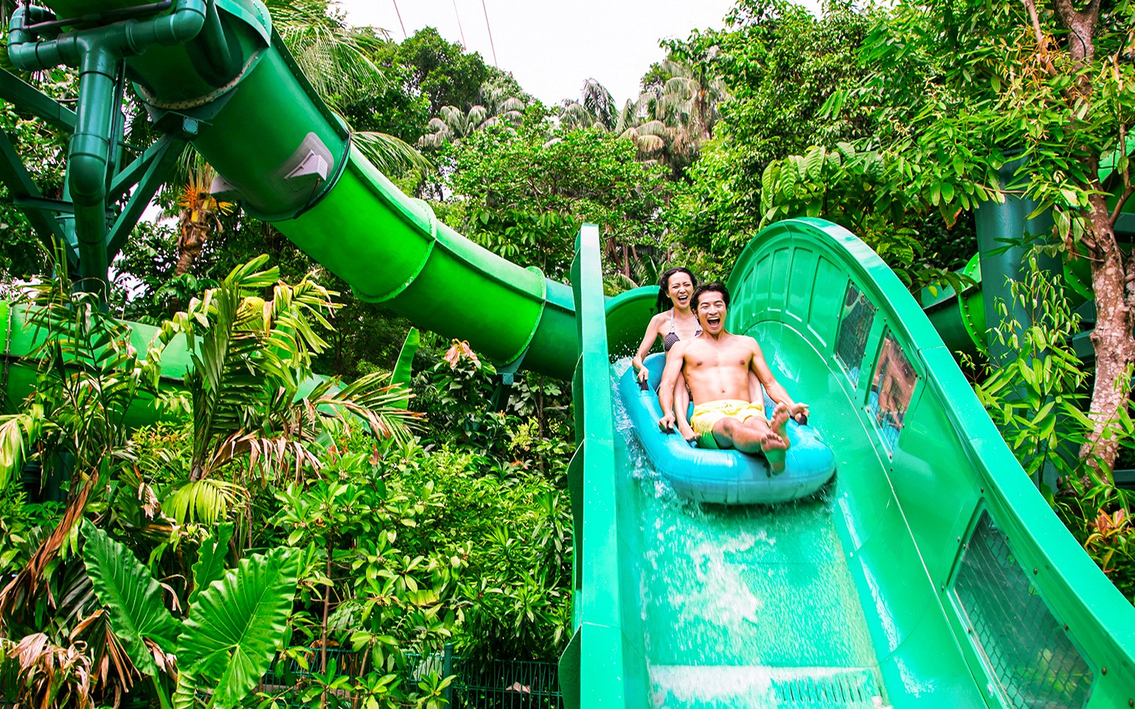 People enjoying the Riptide Rocket ride at Adventure Cove Waterpark, Sentosa, Singapore.