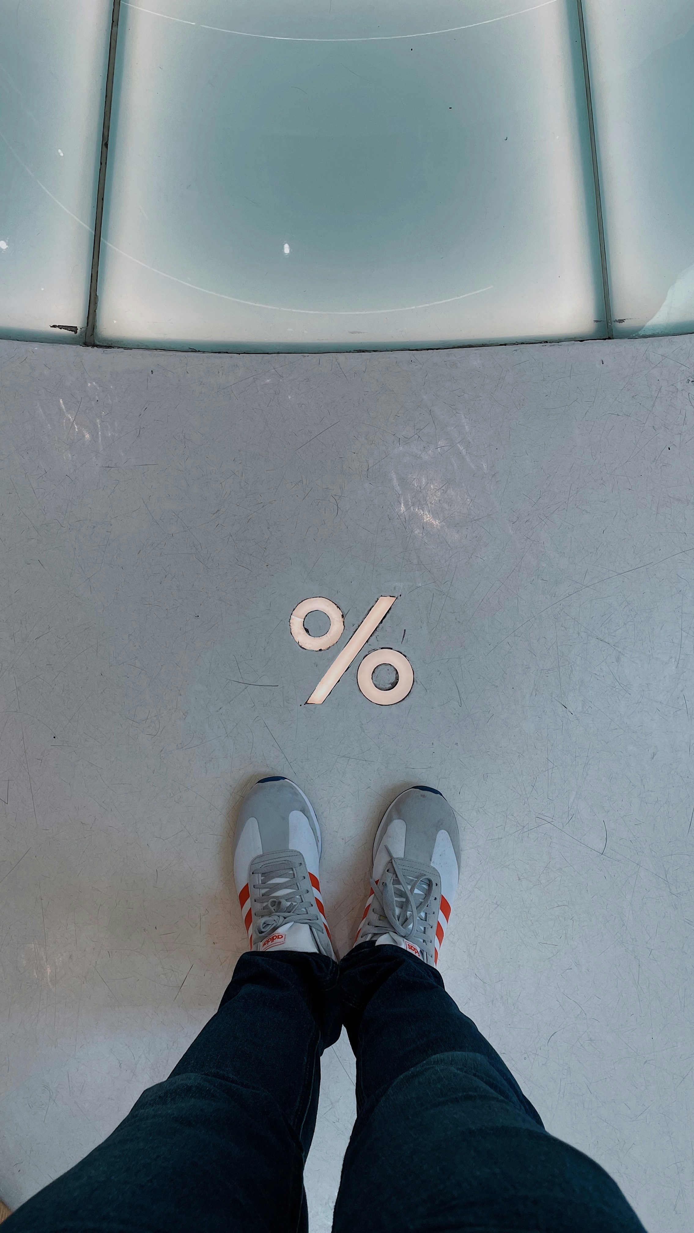 a person standing in front of a sign that says 90