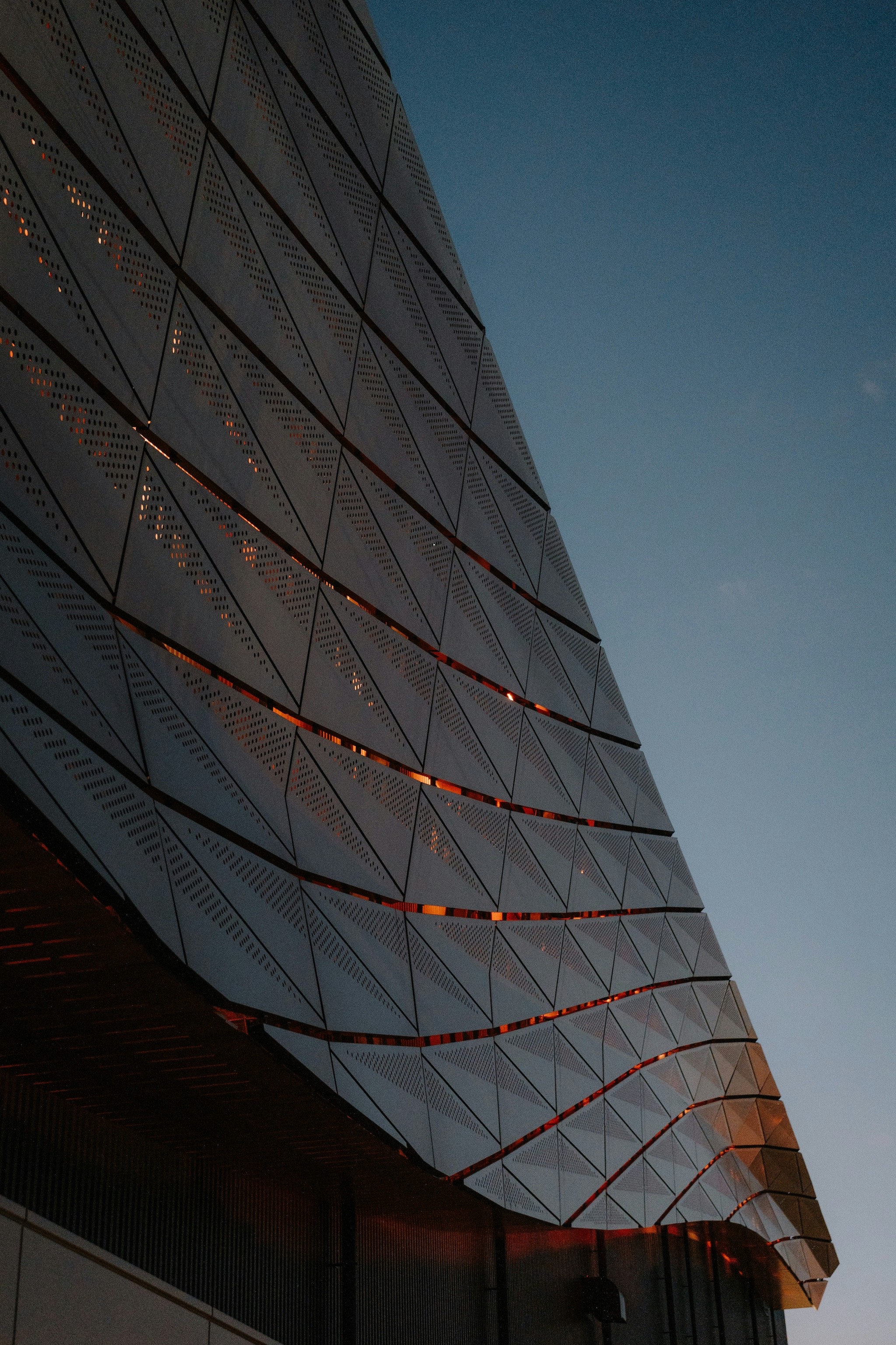 Modern building facade against a clear blue sky