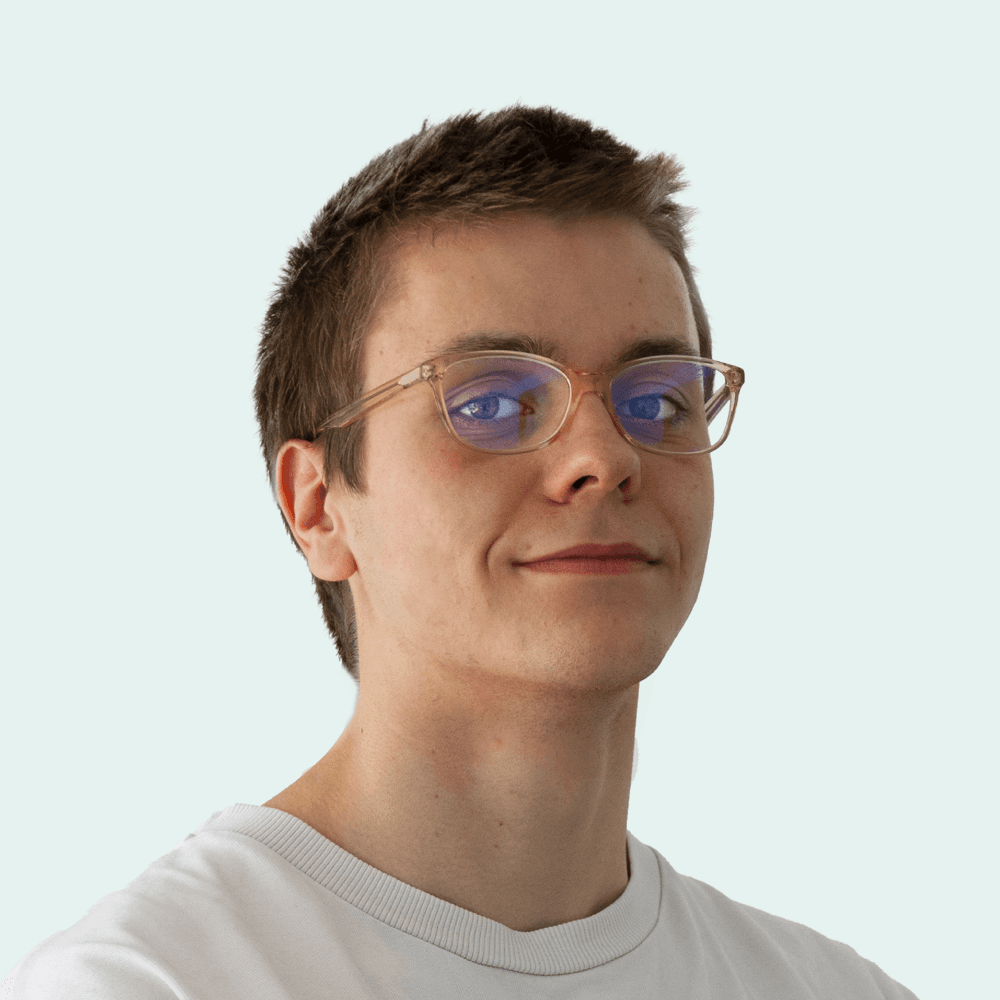 Portrait of a person in dark clothing speaking on a phone