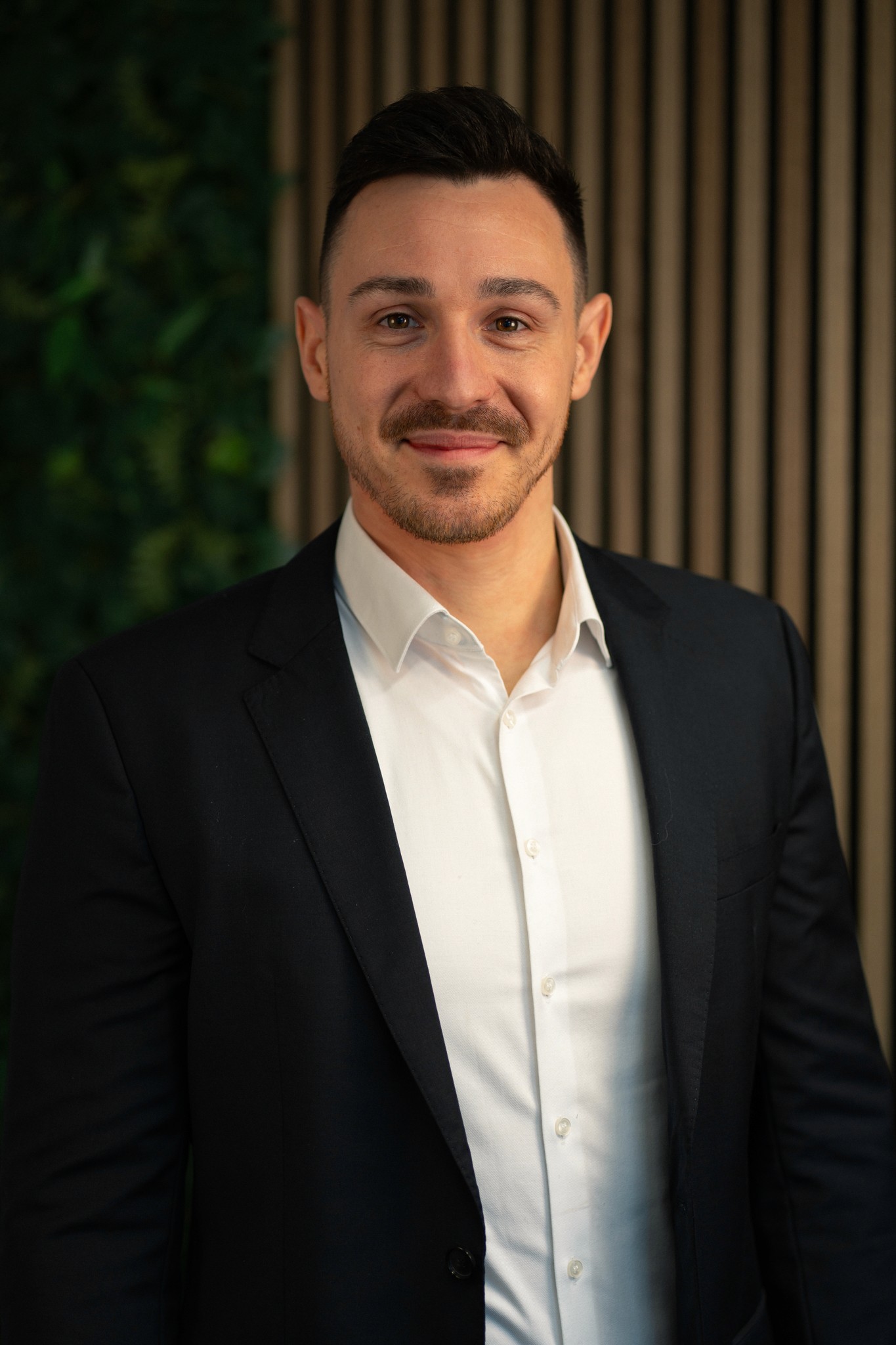 A machine cutting a piece of metal with sparks