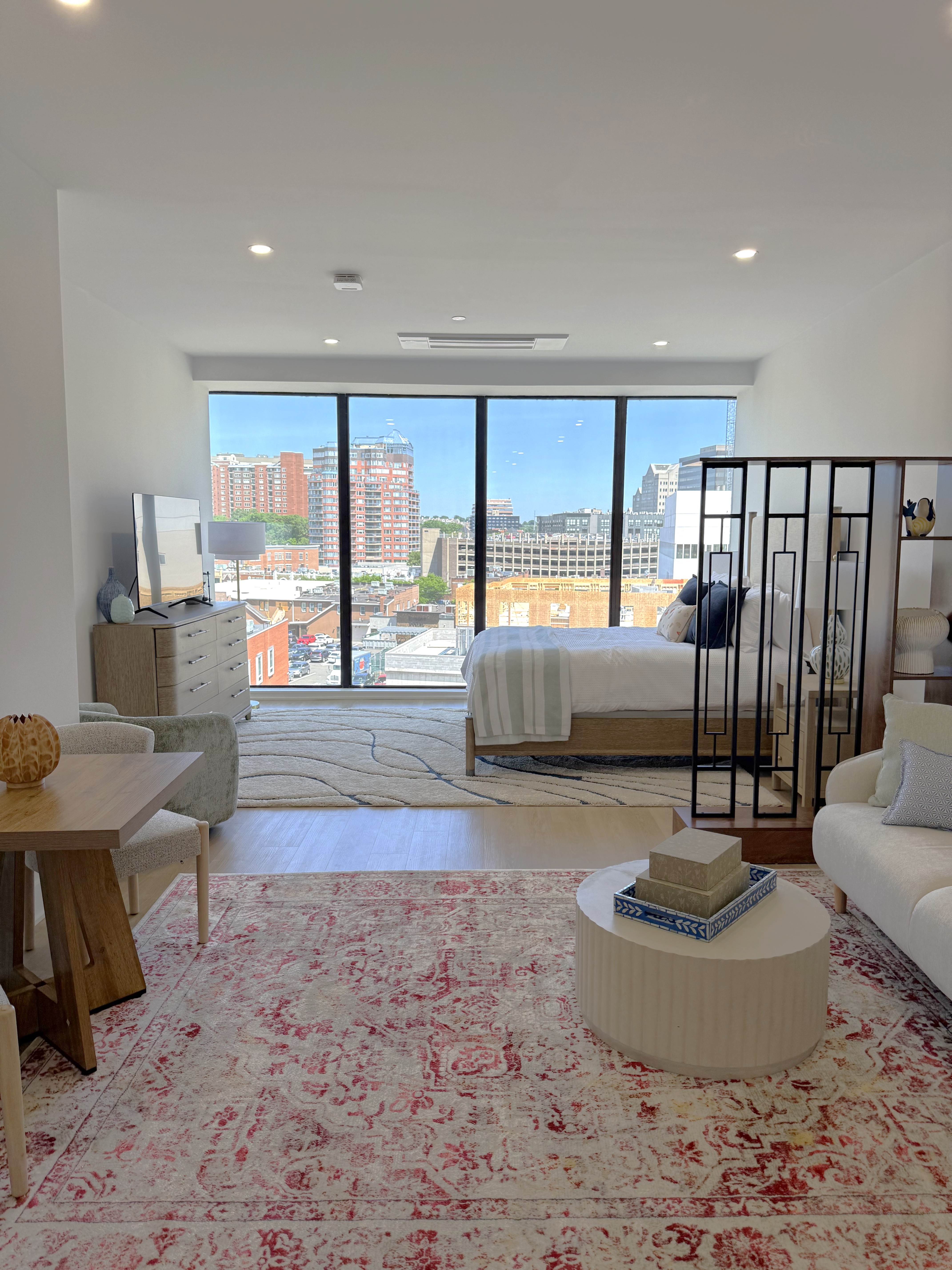 Bedroom: Bedroom with oversized windows at 460 Summer in Stamford. Studio apartment.