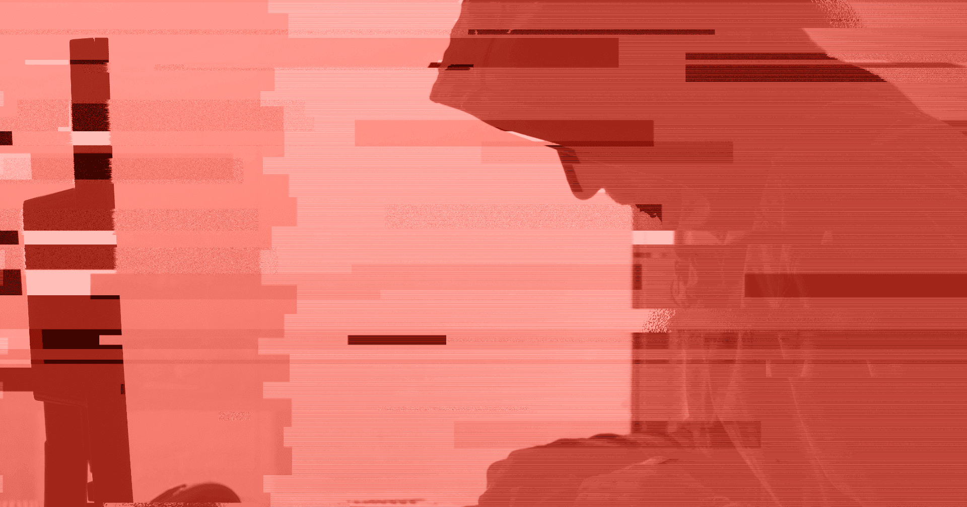 A hooded figure surrounded by red digital distortion and glitch effects, symbolising the financial crime technology gap and the urgent need to close vulnerabilities in outdated systems.