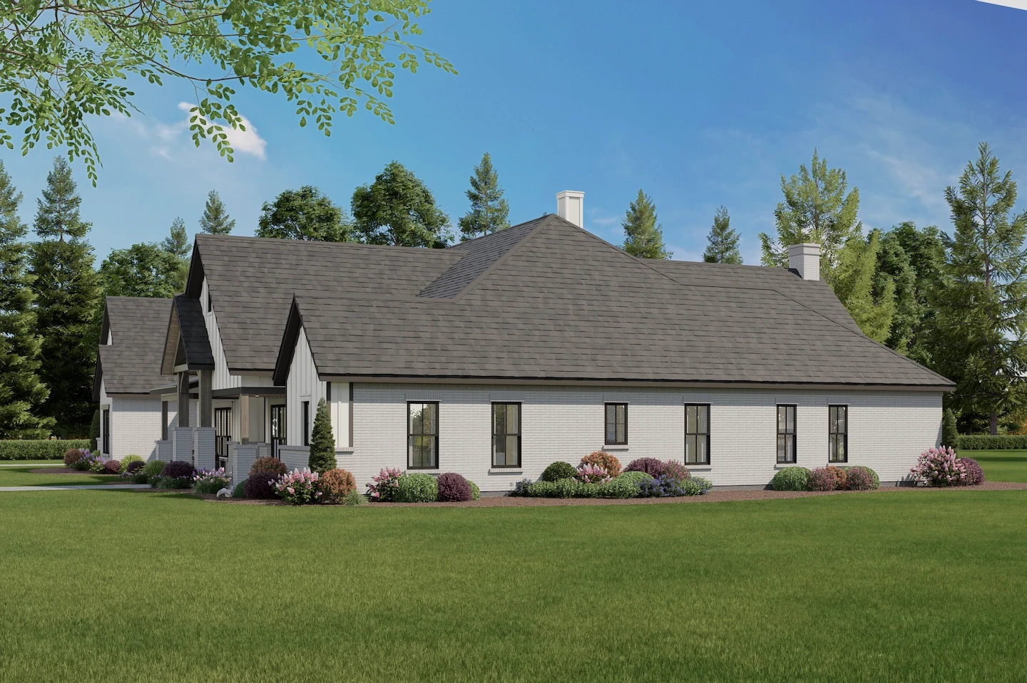 Rear angle of the house with clean lines and white brick siding, complemented by neat landscaping and a peaceful setting.