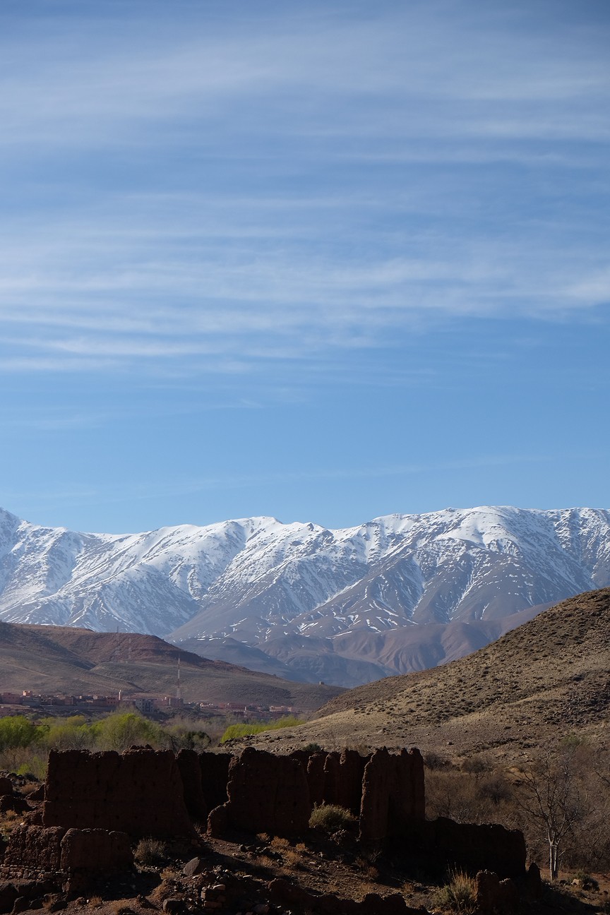 Elderly man with long white beard and conical hat