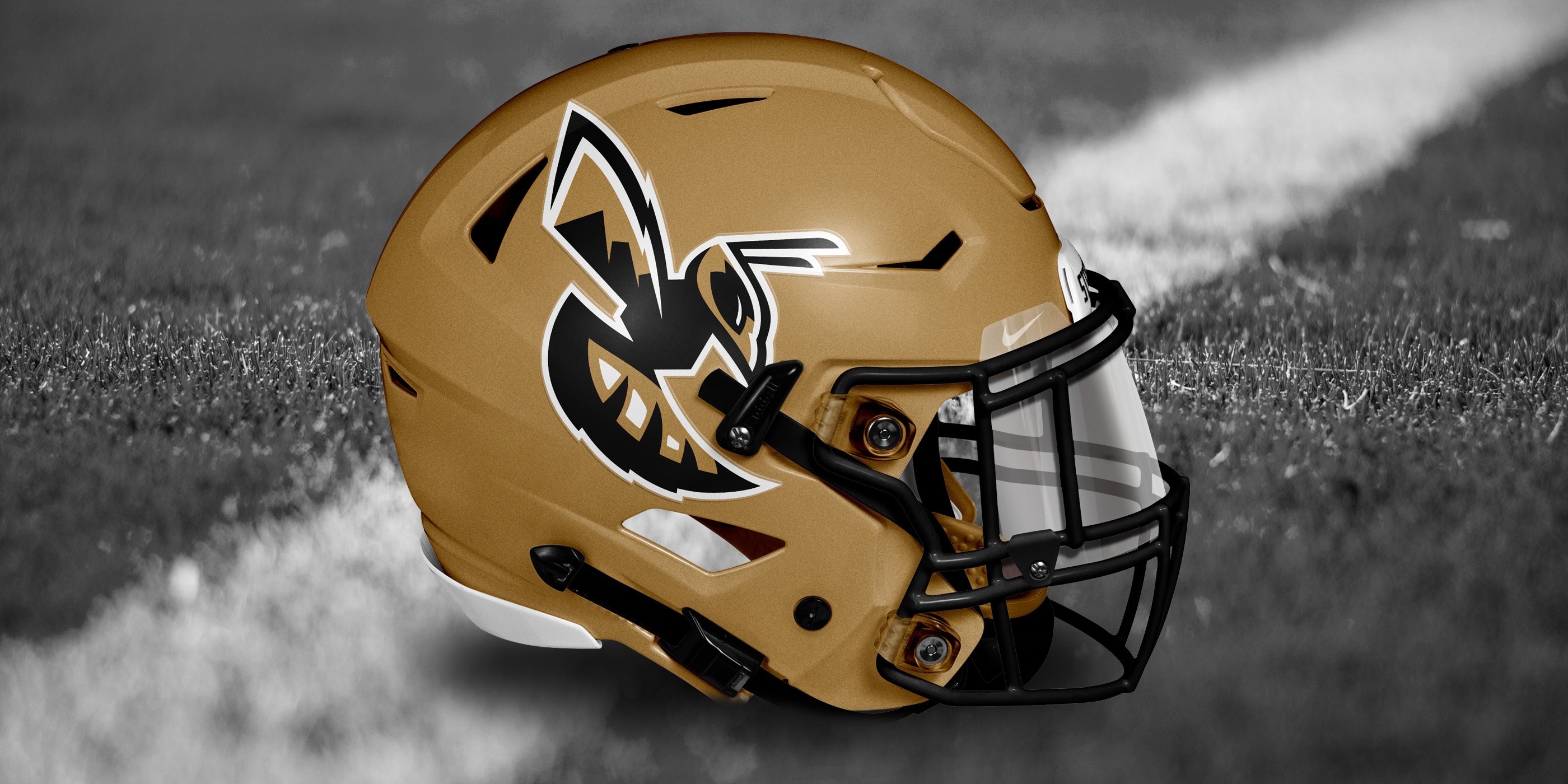 Stevensville School yellowjacket primary logo mocked up on gold football helmet.