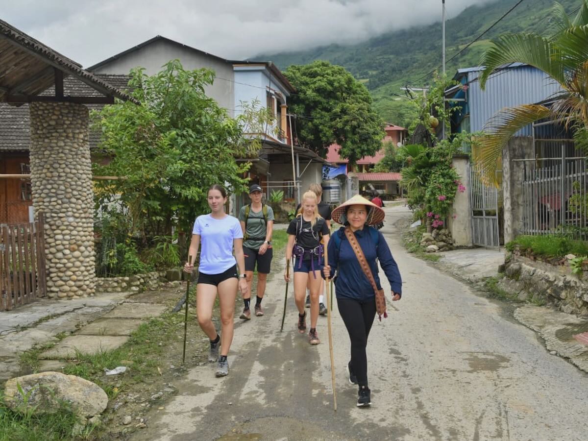 Walking through a village near Sapa with a local guide