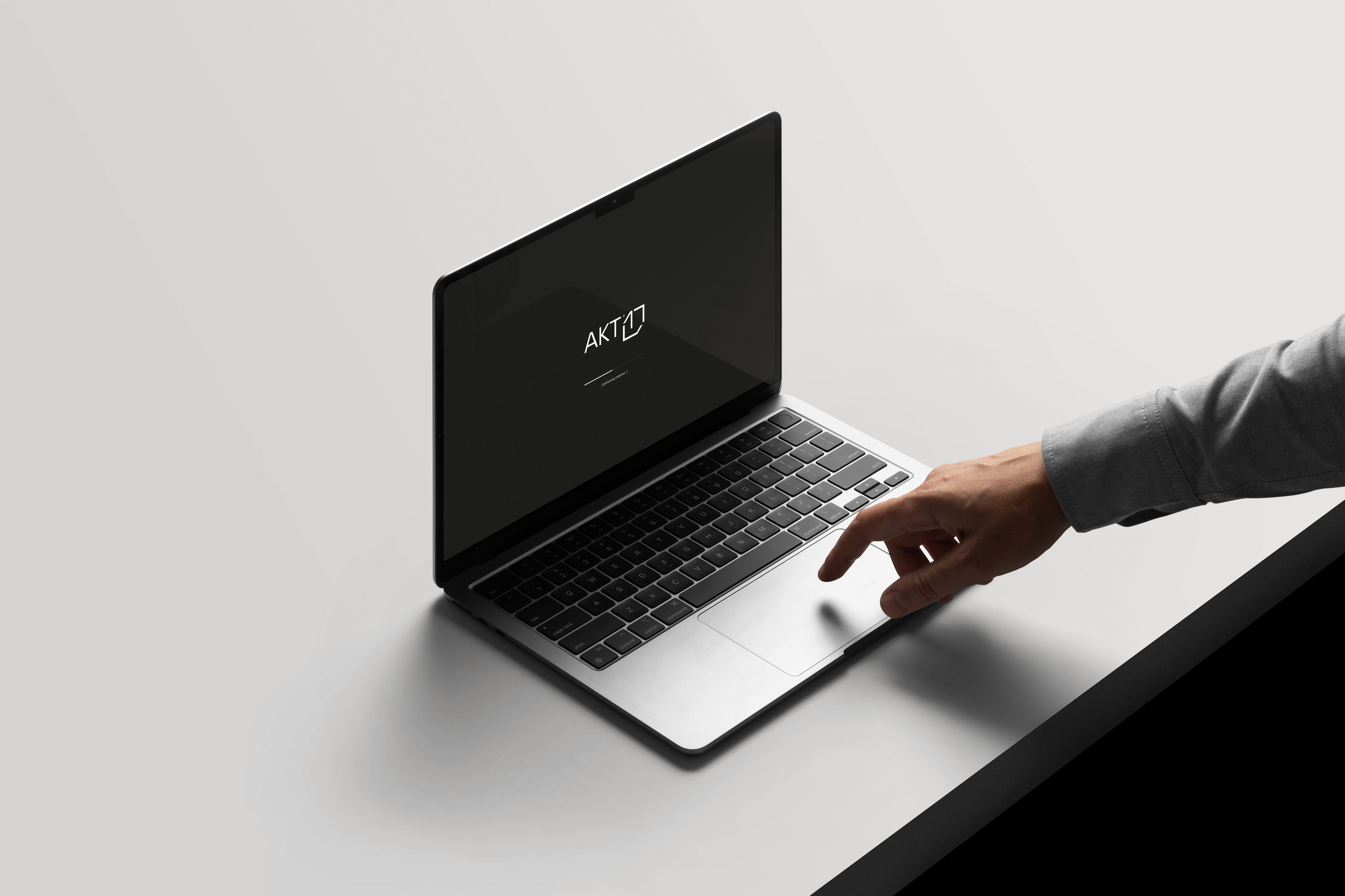 AKT 17 - Logo on macbook screen mockup