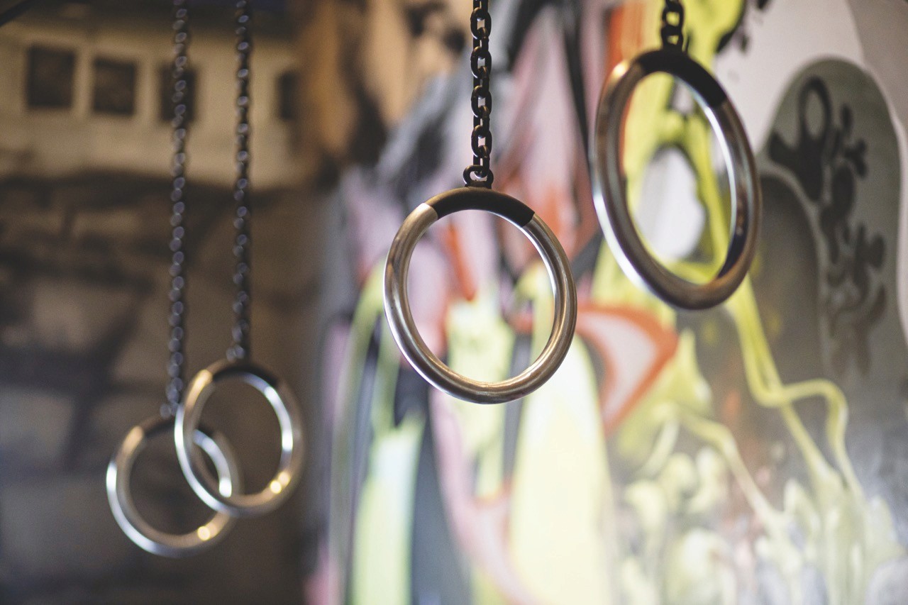 Stone church steeple rising above traditional half-timbered houses.