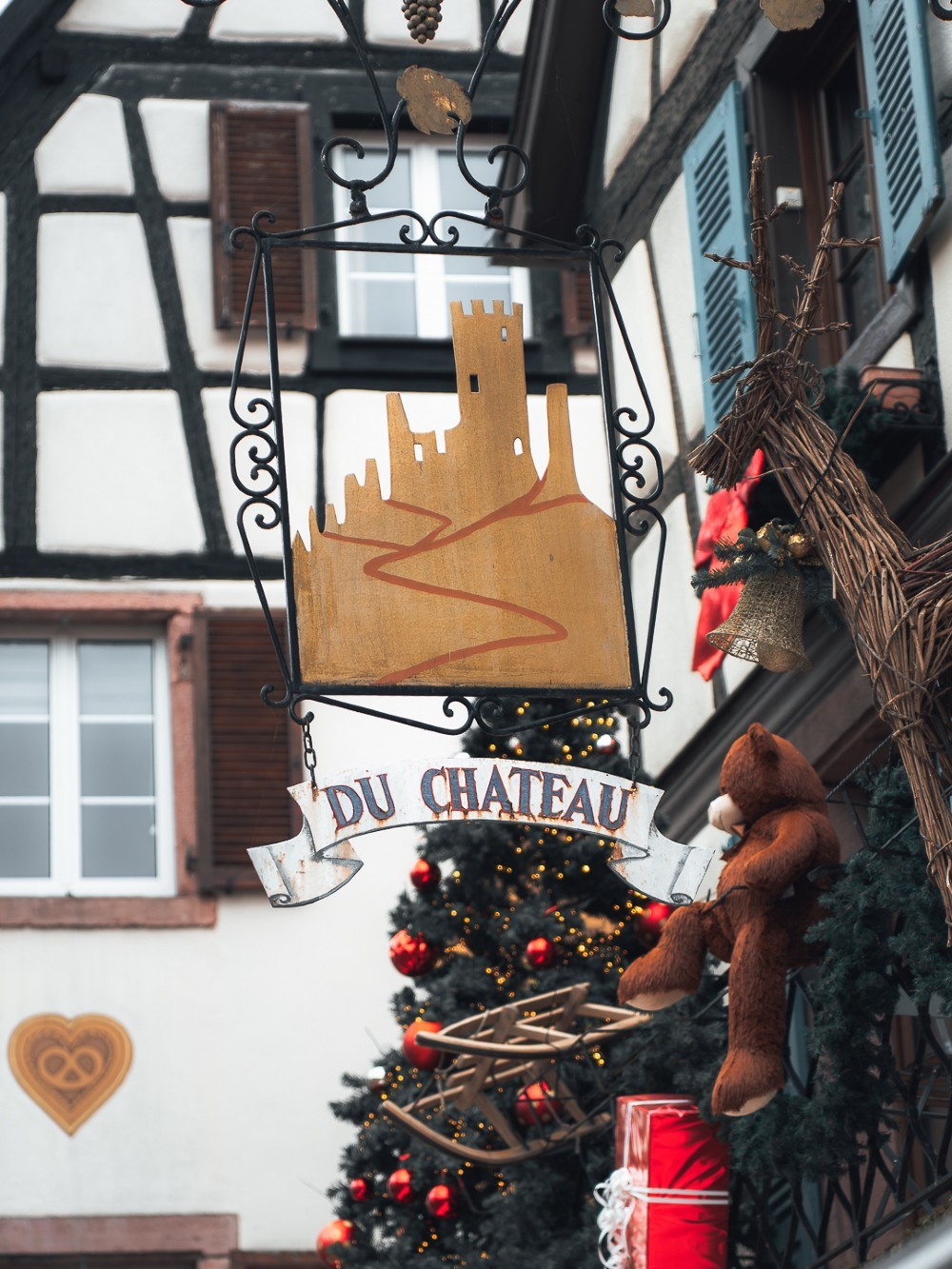 Restaurant exterior with black facade and welcoming atmosphere.