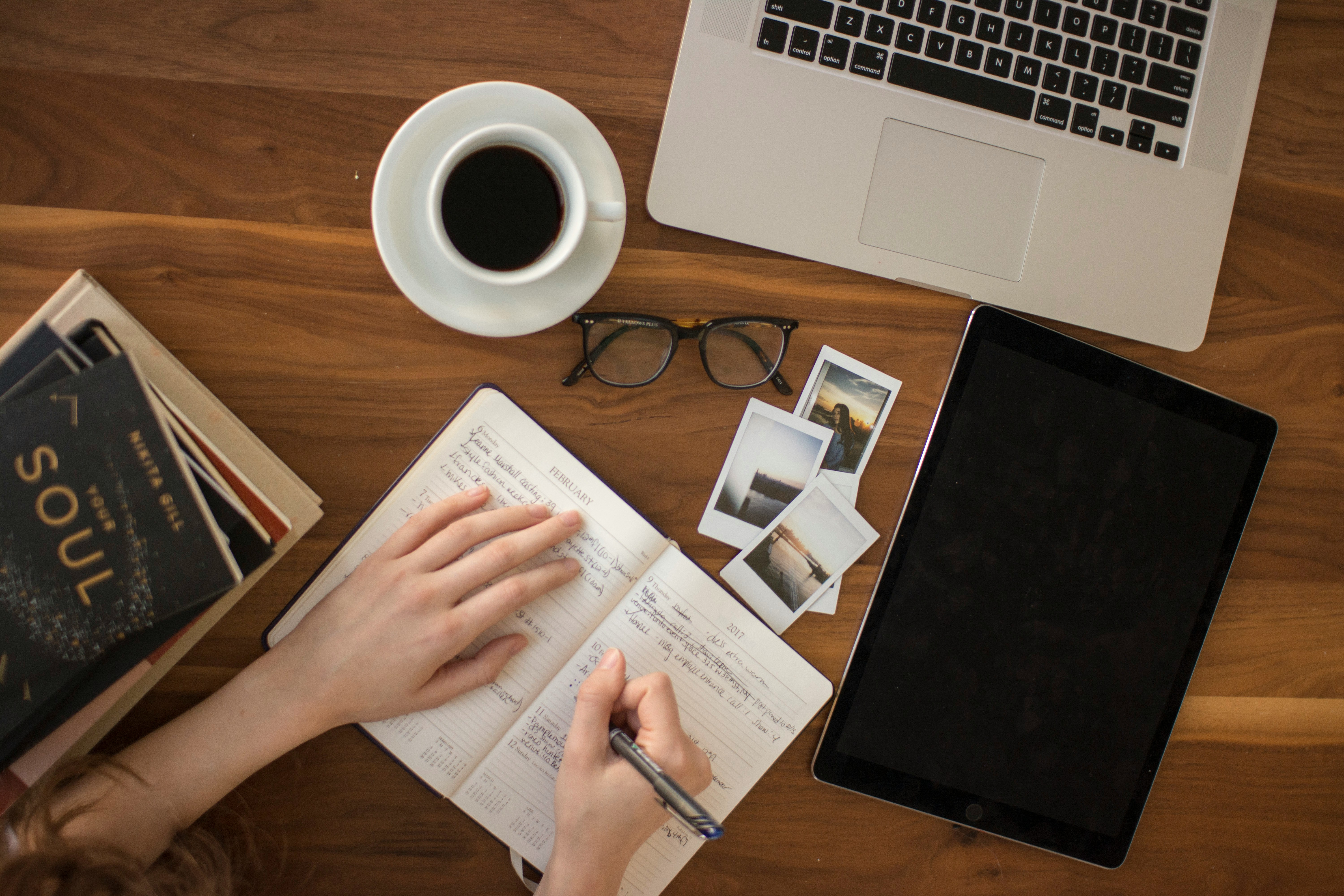 girl writing on a notebook to Summarize Research Paper AI 