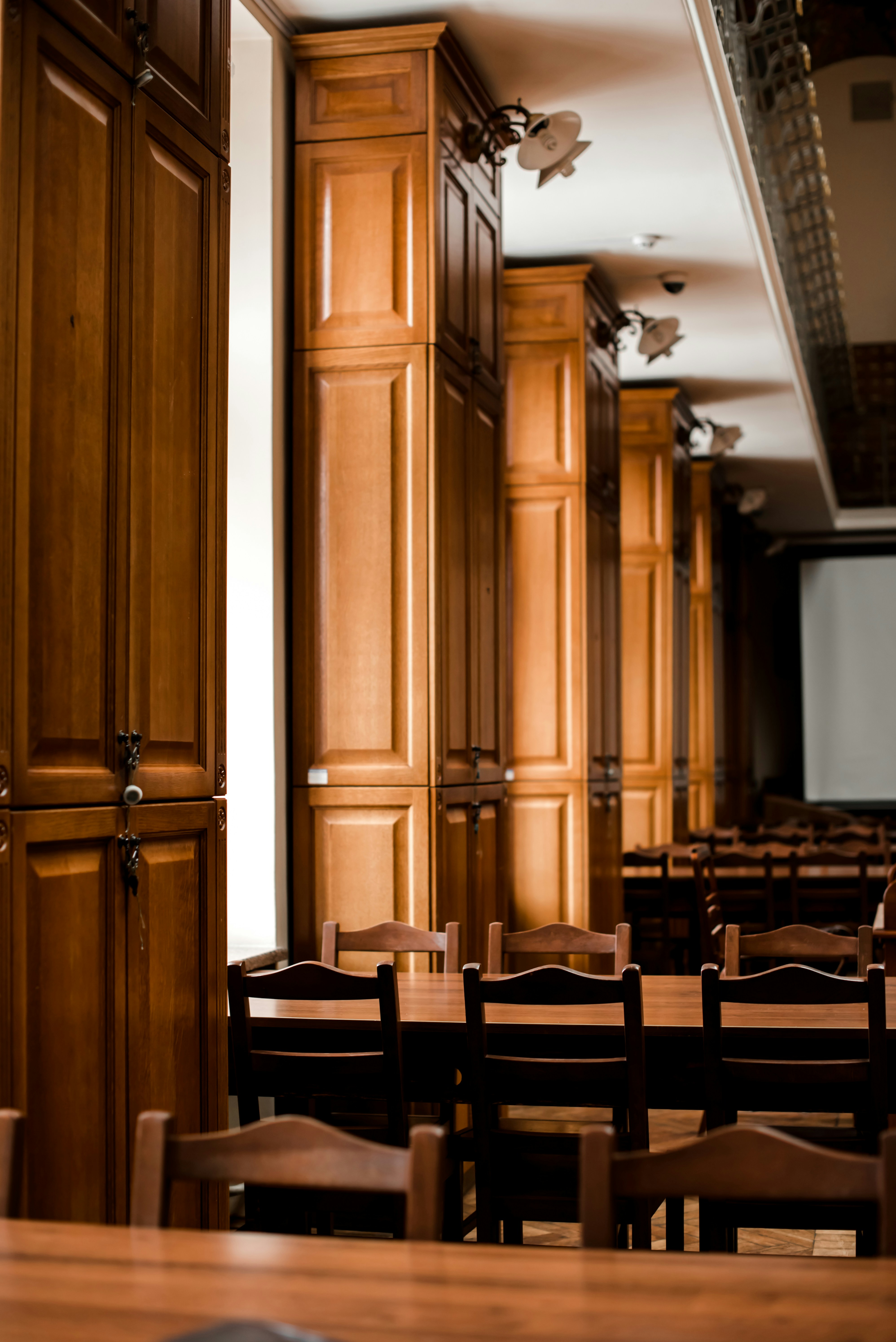 a room filled with wooden tables and chairs