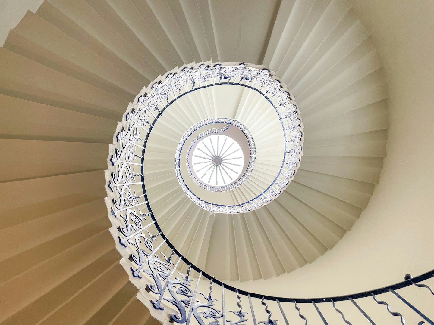 Spiral stair beneath a naturally lit skylight