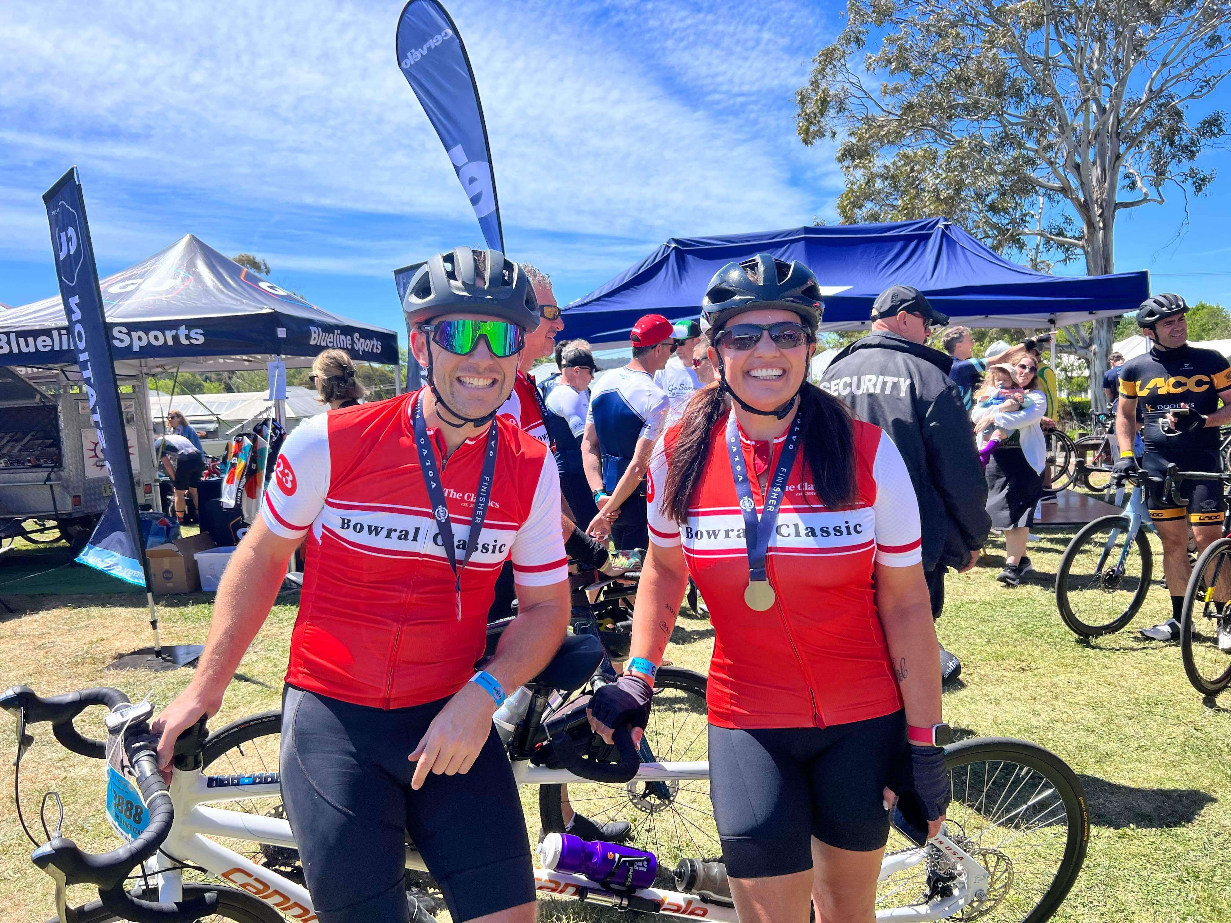 Lily pictured with her Pilot, Dan, and bike after competing in the Bowral Classic