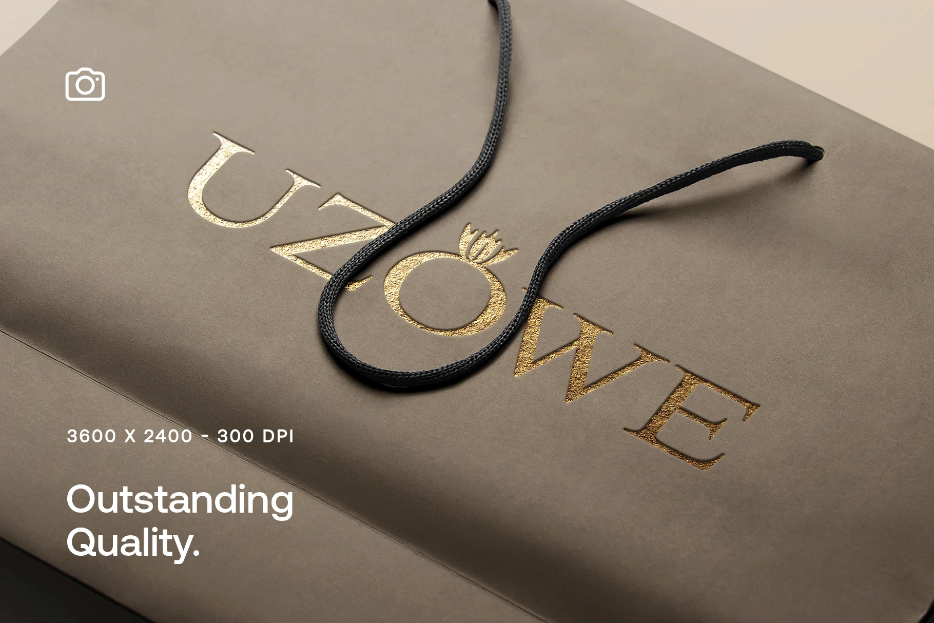 Elegant gold foil logo mockup on a luxury shopping bag with string handle.