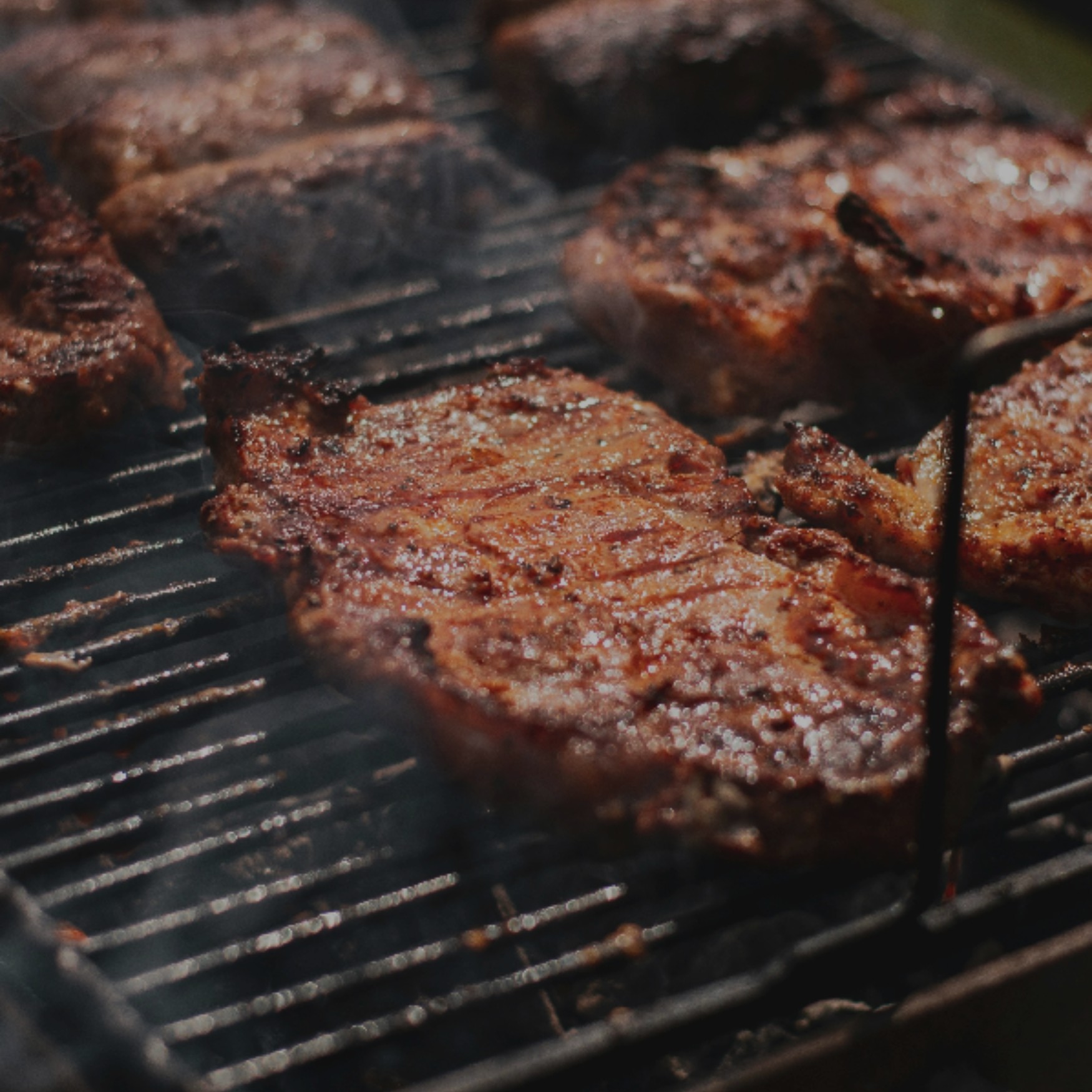 grilled meat on black charcoal grill