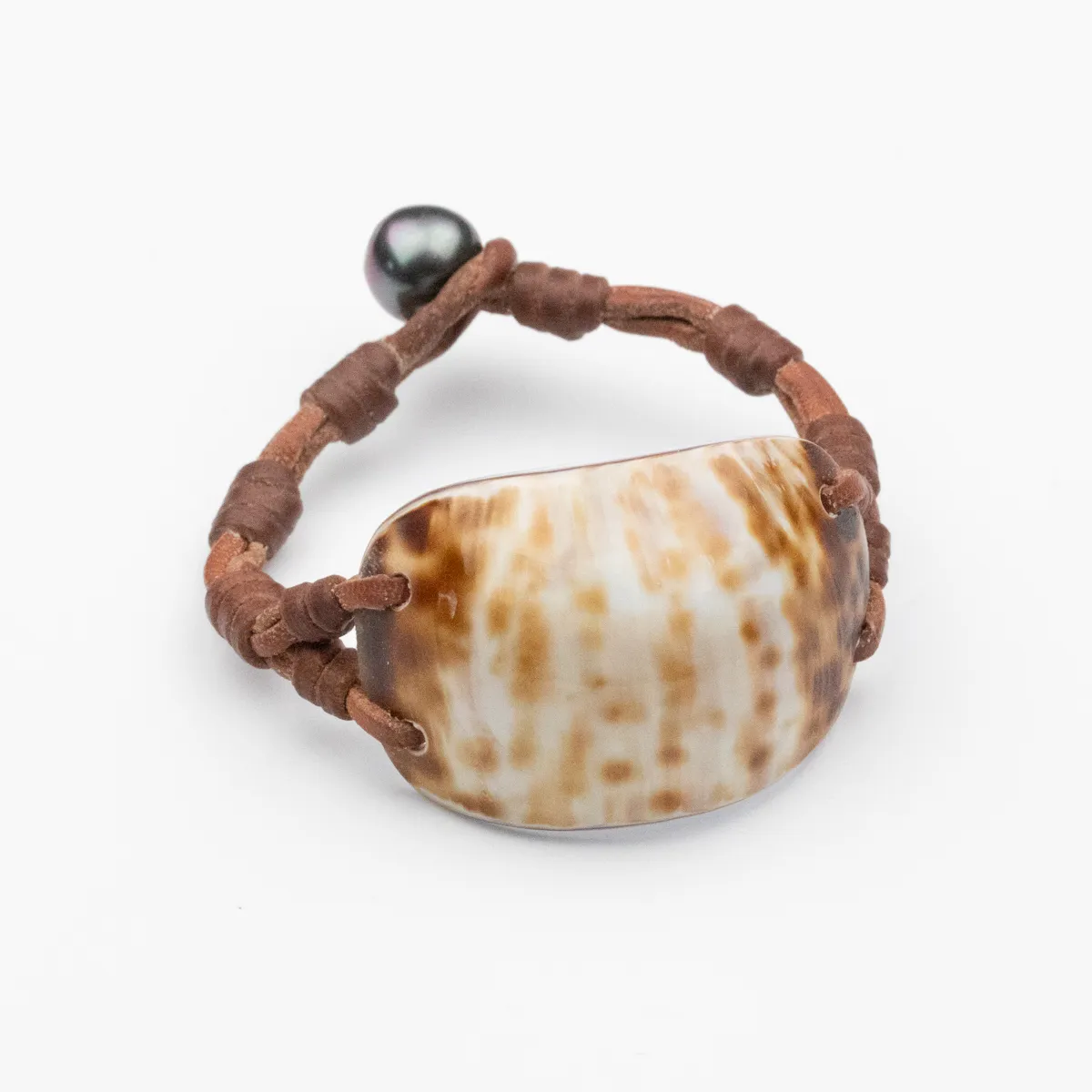 Seashell and Tahitian Pearl bracelet on hand-knotted brown leather cord with pearl toggle closure — Manos de Oro Saint Barth